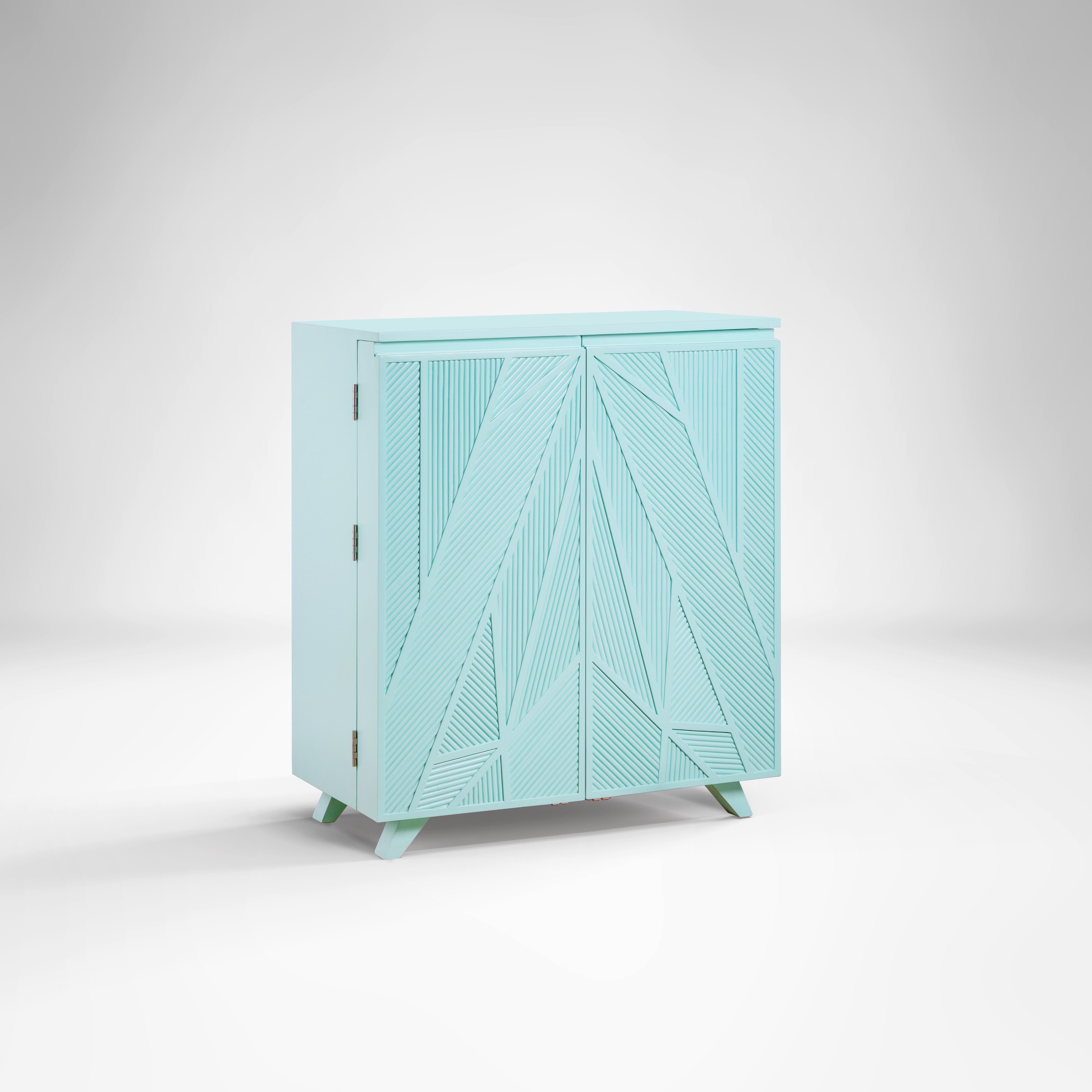 Tiffany blue geometric bar cabinet inspired by Ancient Egypt use of Palm Branch
Our unique Cool Palm bar cabinet manifests Ancient Egyptian woven palms in a vibrant Tiffany blue shade. The dynamic pattern will surely give life to your room with its