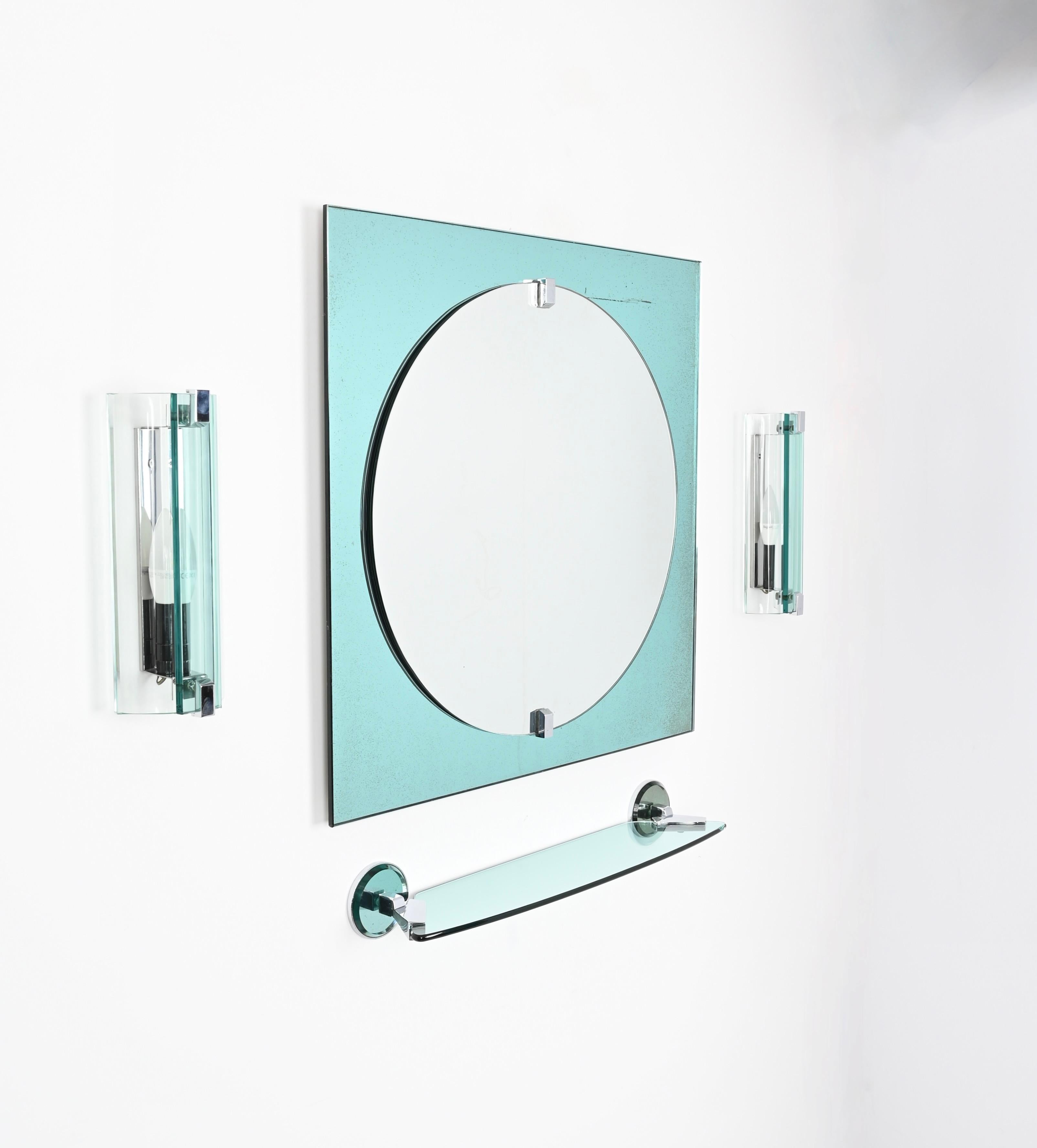 Magnificent Italian bathroom set in a lovely blue tiffany colored artglass and chromed steel that includes a sqaure mirror, two sconces and a wall shelf. These fantastic items were made by VECA in Italy during the 1970s and are signed on the back of