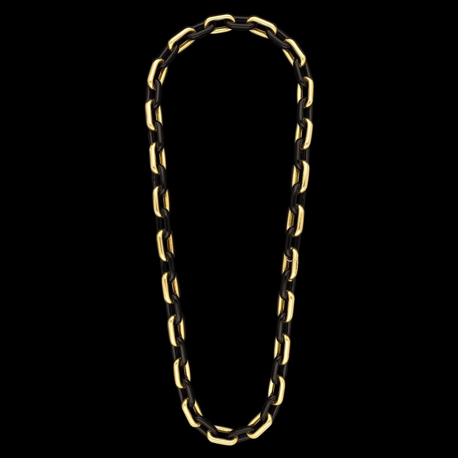 A bold 18ct gold and black onyx long chain sautoir necklace by Tiffany & Co. circa 1970s, designed as a 31” long chain formed of large rounded rectangular links of 18ct yellow gold alternating with the same size and shape of link in black onyx, to a