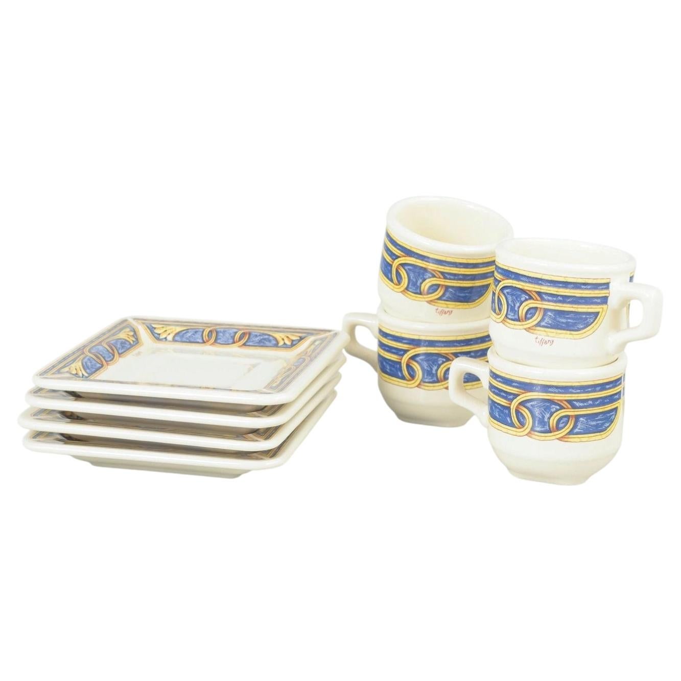 Tiffany Boutique. Set of four espresso cups with saucers with ornamental motifs.