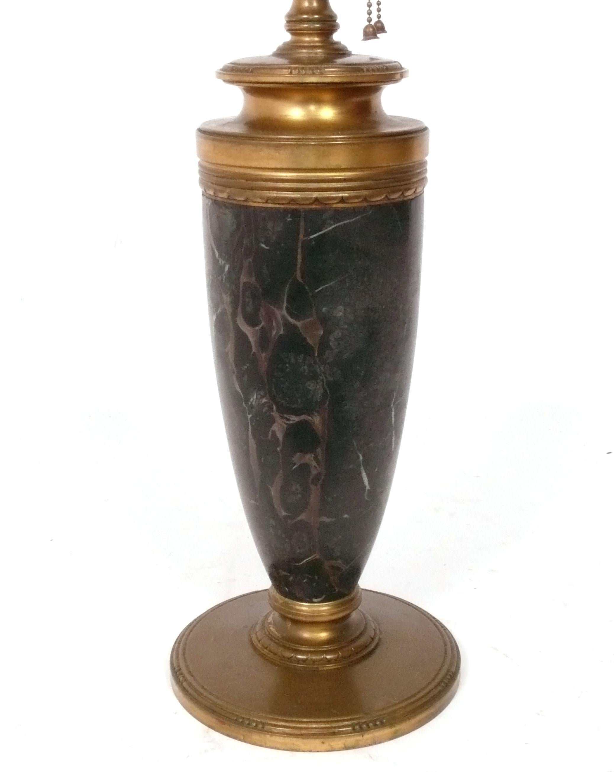 Elegant Bronze and Marble Lamp, made by Tiffany and Company, American, circa 1910s. Signed on bottom with Tiffany & Co. brand. The black marble features gold veining which pairs perfectly with the patinated bronze. The lamp has been rewired with a