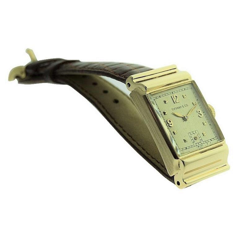 FACTORY / HOUSE: Tiffany & Company by International Watch Co. 
STYLE / REFERENCE: Art Deco / Tank Style
METAL / MATERIAL:  14kt. Solid Yellow Gold
CIRCA / YEAR: 1940's
DIMENSIONS / SIZE: Length 38mm X Diameter 22mm
MOVEMENT / CALIBER: Manual Winding