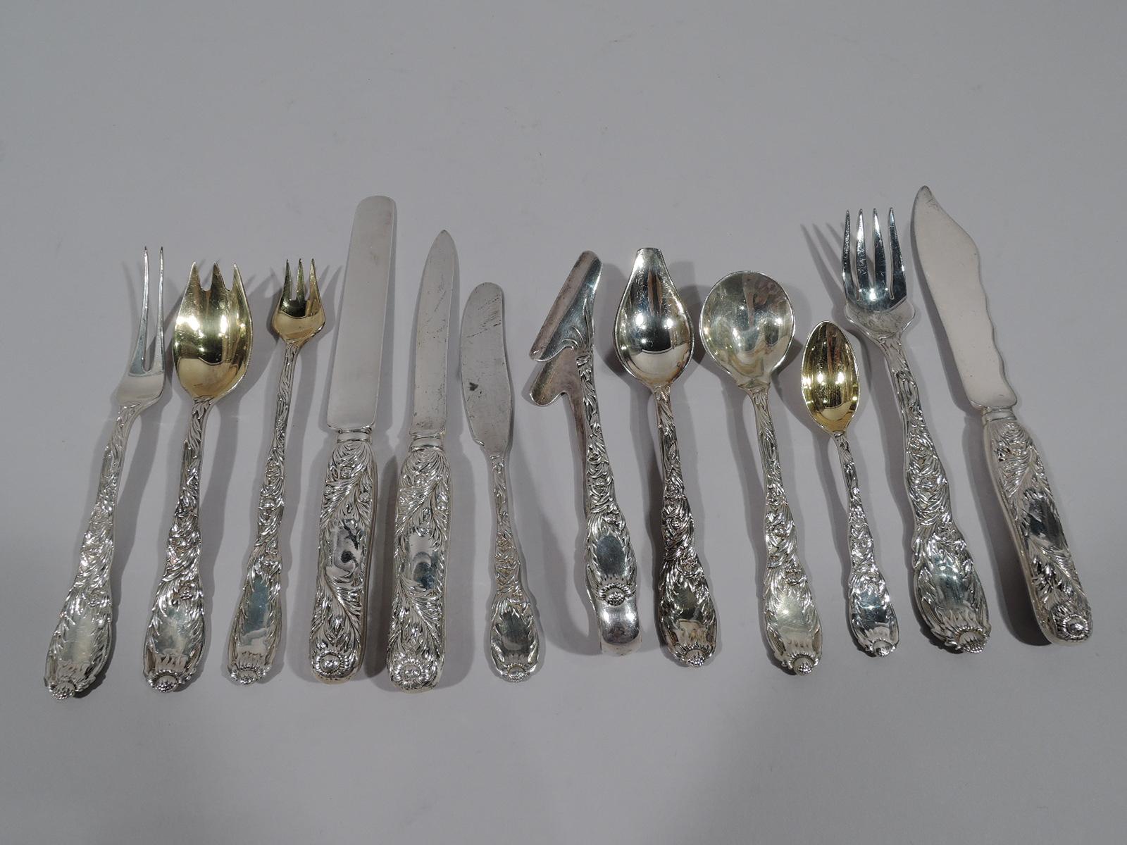 Chrysanthemum sterling silver dinner set for 12. Made by Tiffany & Co. in New York, circa 1910.

This set comprises 252 pieces (dimensions in inches): Knives: 12 dinner knives (10), 12 lunch knives (9), 12 breakfast knives (7 1/2), 12 fish knives