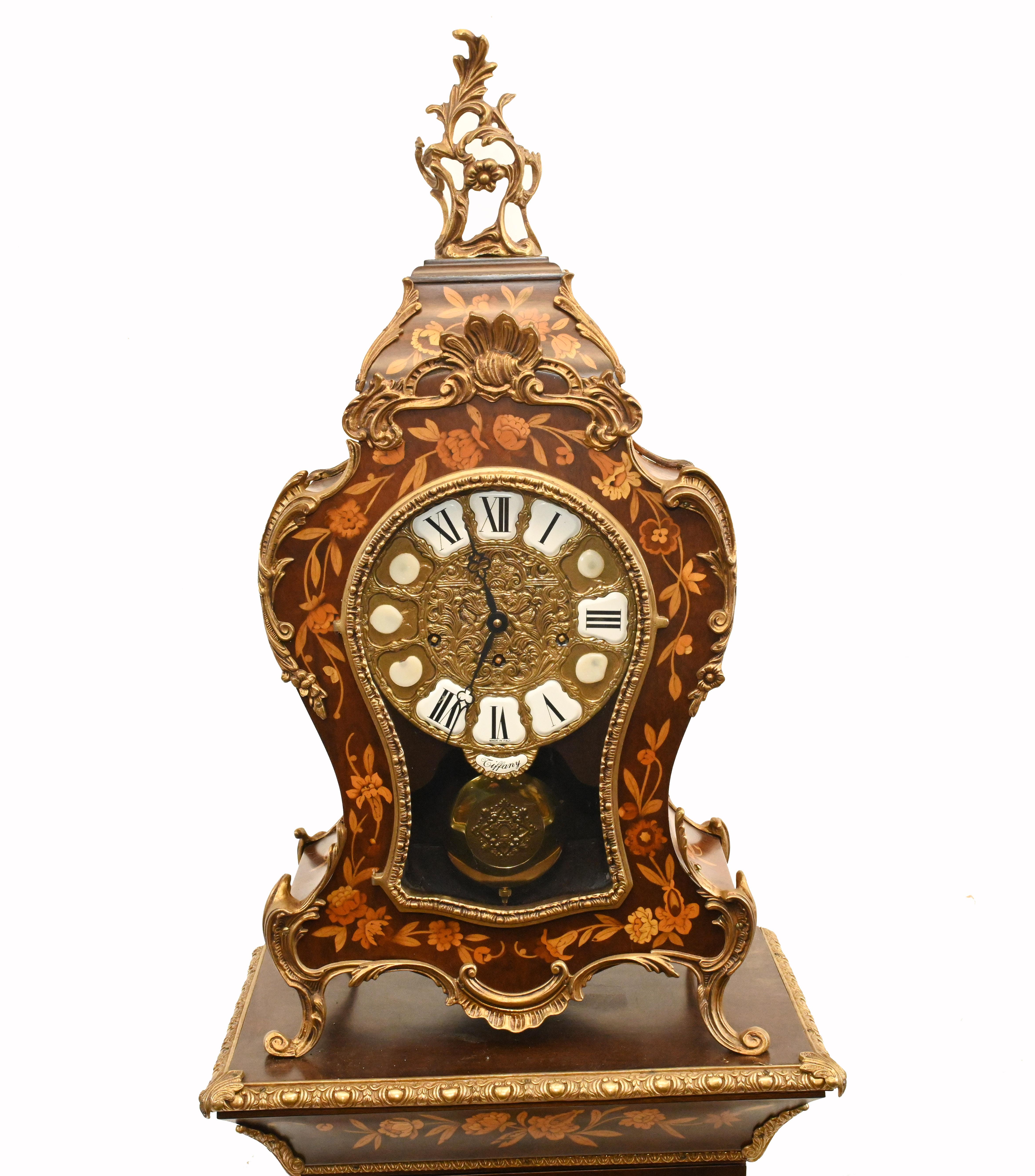 Eye catching Italian Tiffany clock on a pedestal stand
Stand is actually a glass fronted cabinet that opens out
Piece is circa 1920 and the clock chimes
Intricate floral marquetry inlay on all surfaces
Bought from a dealer on Marche Biron at Paris