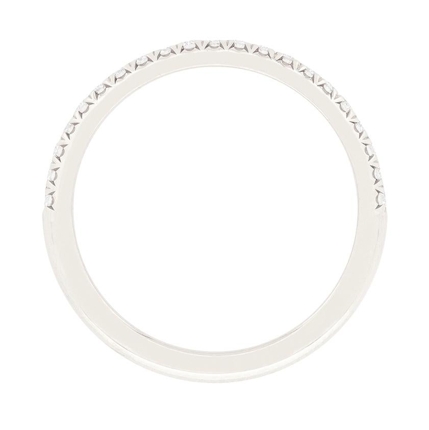 This classic half eternity band is part of Tiffany & Co.’s ‘Soleste’ collection. This band is crafted in platinum and is micro set with 0.17 carat of round brilliant cut diamonds. They are excellent quality, matching at F in colour and VVS in