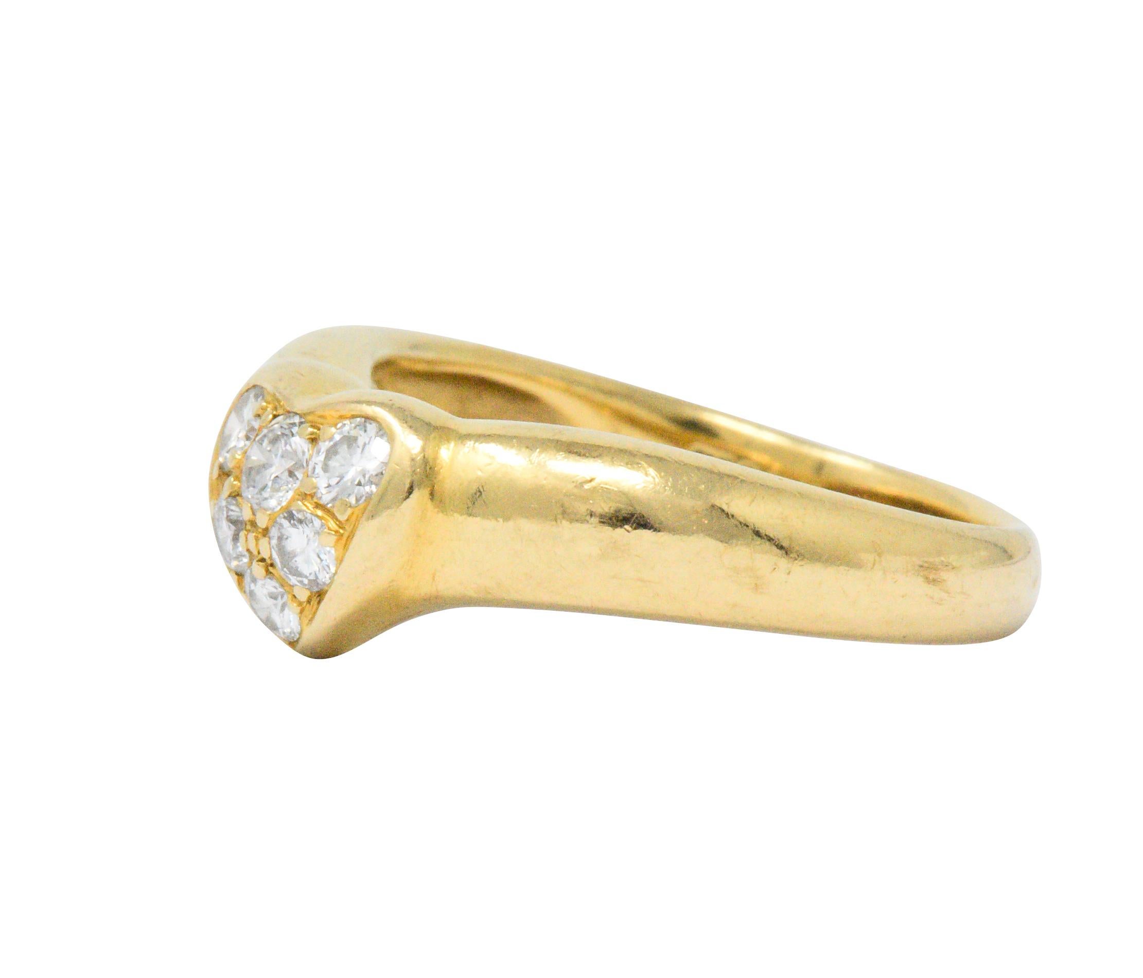 Centering a heart, with six bead set round brilliant cut diamonds, weighing approximately 0.25 carats total, G/H color and VS clarity

The heart blends effortlessly into the wide polished gold shank

Sweet fun ring

Fully signed Tiffany & Co. 

Ring