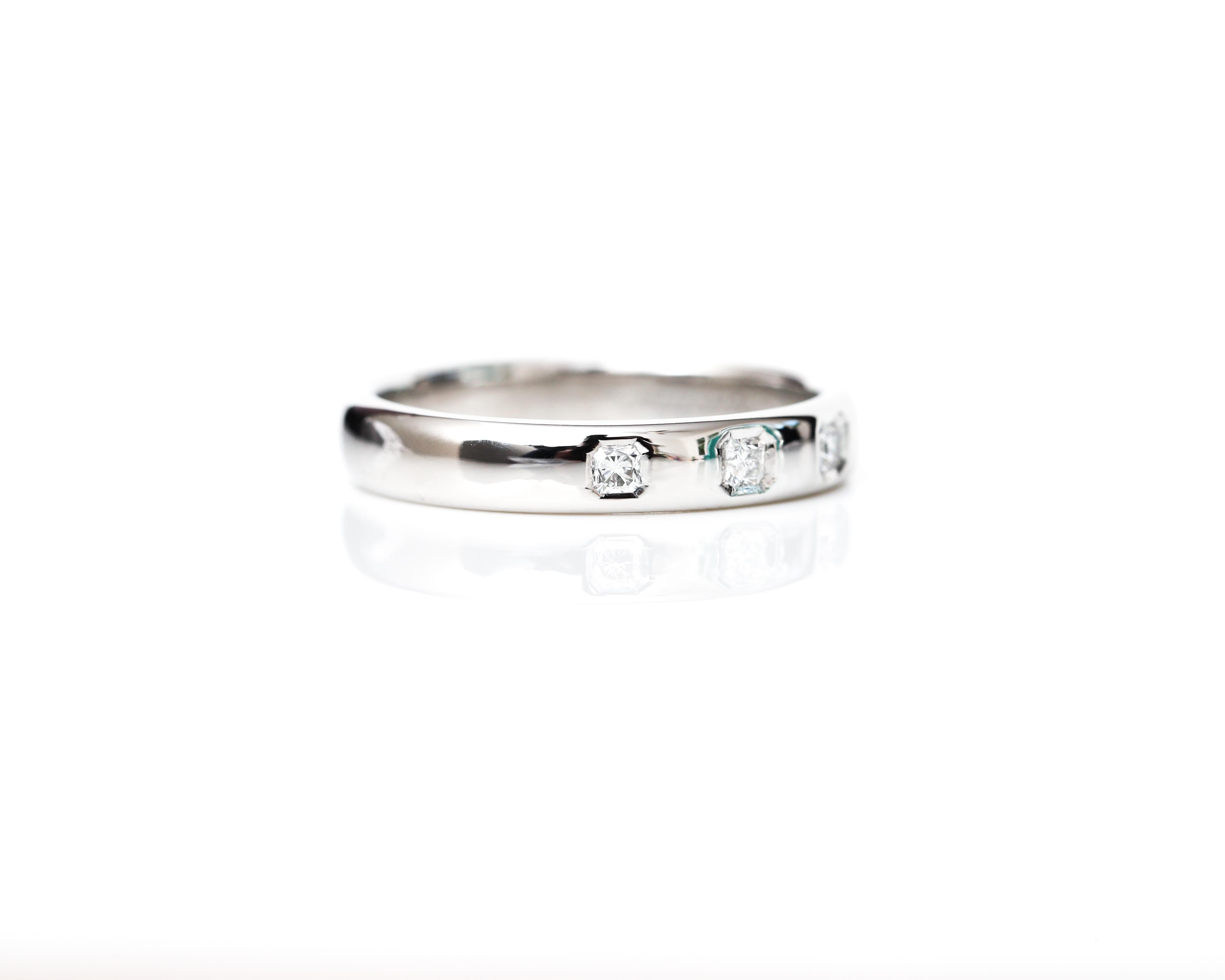 Tiffany & Co designer Diamond Band from the 1990s!
Featuring 3 beautiful diamonds, weighing 0.25 carat total, F color, VS clarity 
The band is hallmarked with Tiffany & Co stamp as well as Platinum Stamp.
This band comes with an original Tiffany &
