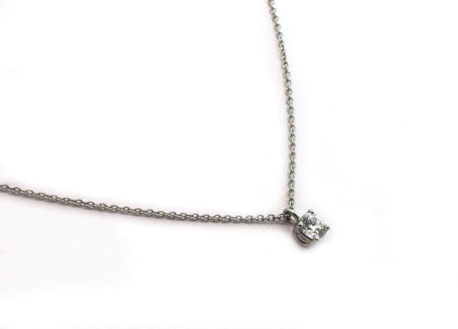 Tiffany & Co Diamond Solitaire Pendant Necklace in Platinum

Tiffany & Co Diamond Necklace
PT950 Platinum
Diamond Weight: approx. 0.25 CT
Chain Length: 16.0 Inches
Weight: approx. 2.8 Grams
Stamped: T&CO, PT950

Offered for your consideration is a