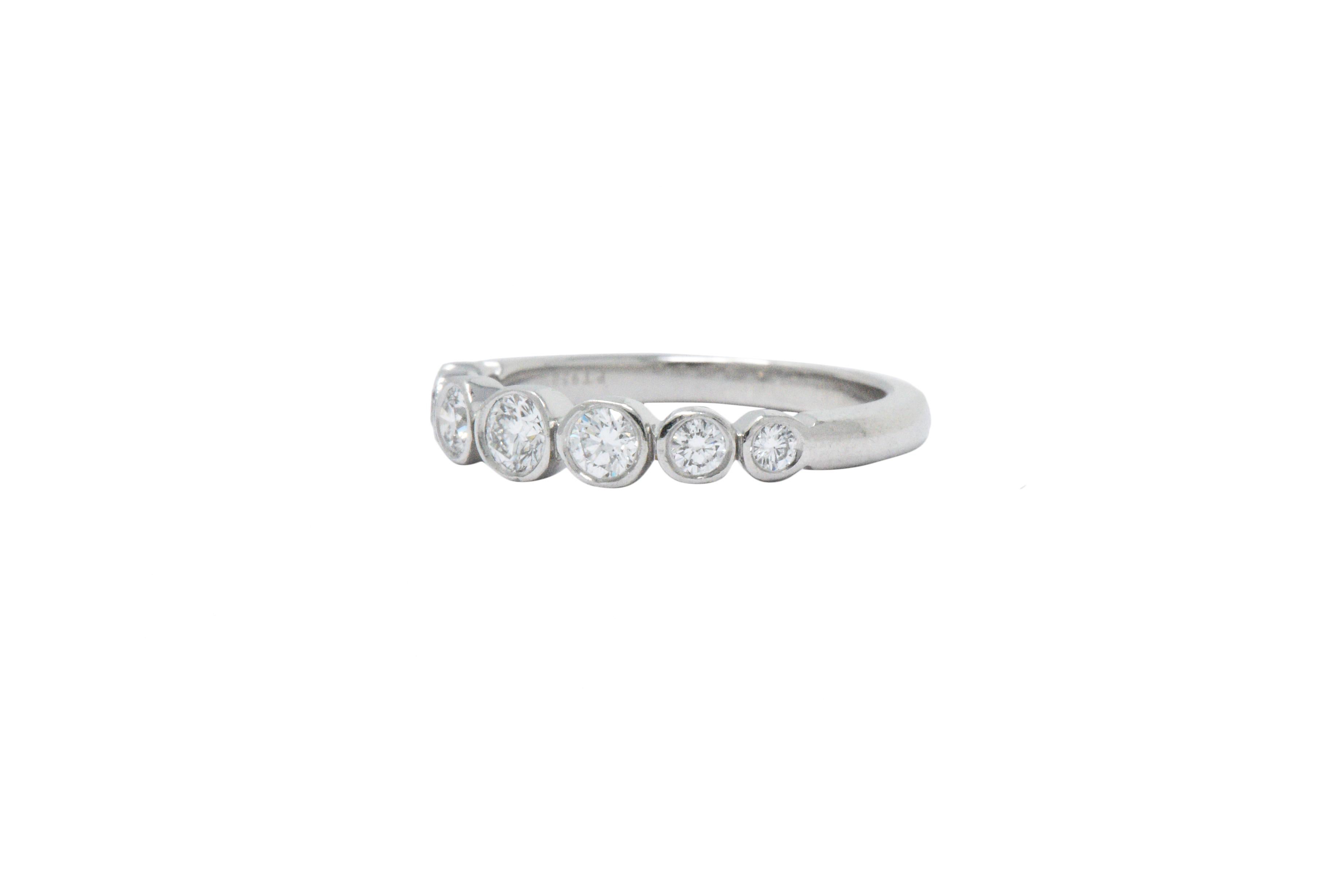 Set to the front with bezel set, graduated round brilliant cut diamonds, weighing approximately 0.35 carats total, G color and VS clarity

Fun ring, with a great contemporary look, so stackable!

Part of the 