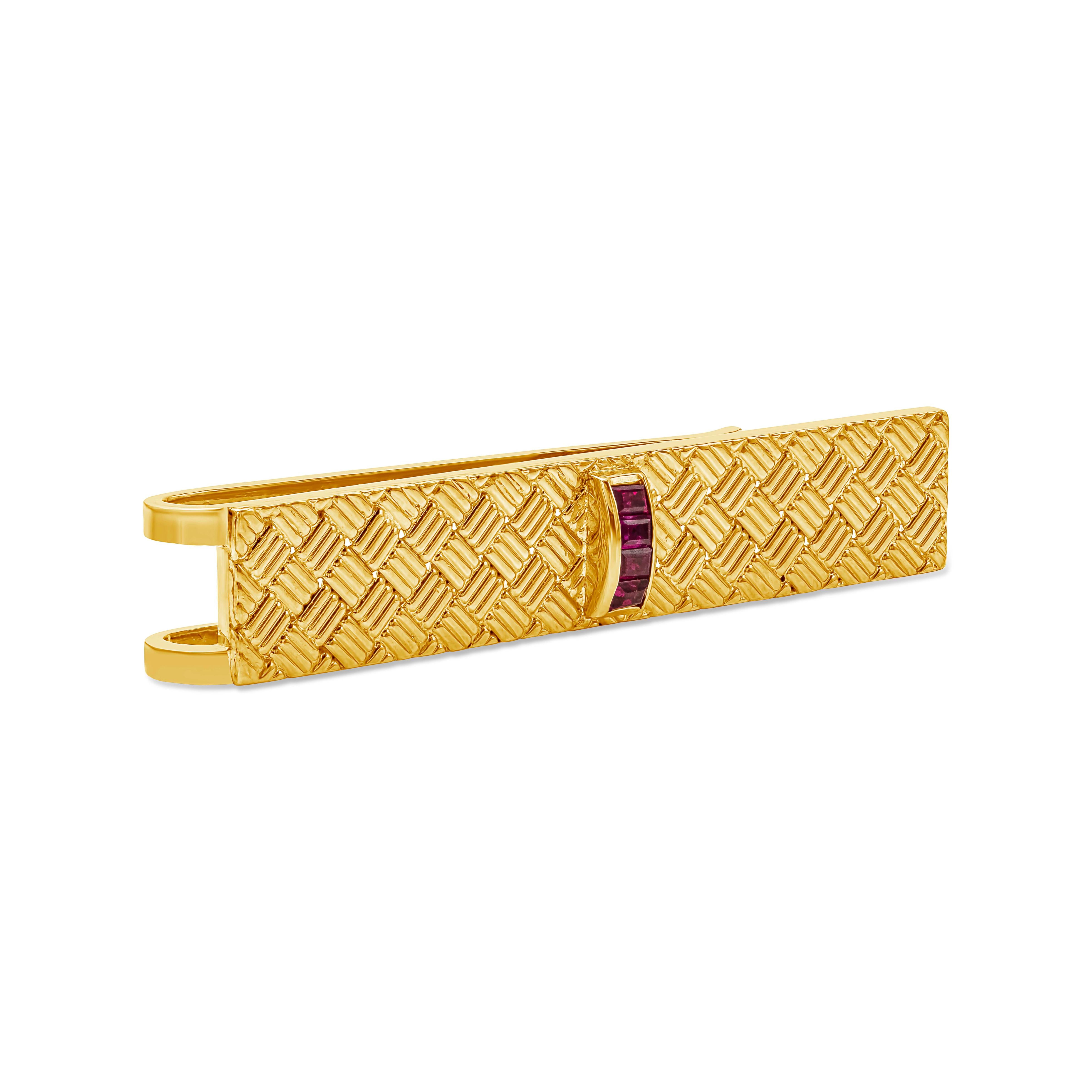 Made and signed by Tiffany & Co. Features a weave design tie clip accented with three rubies in the middle. Rubies weigh 0.35 carats. Made in 18k yellow gold.