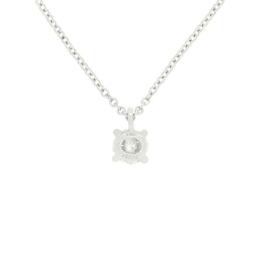 From the designer Tiffany & Co. comes this refined solitaire diamond pendant. With elegance in its simplicity this pendant features a single 0.38 carat, round brilliant diamond at its heart. The diamond is of high quality as is expected from Tiffany