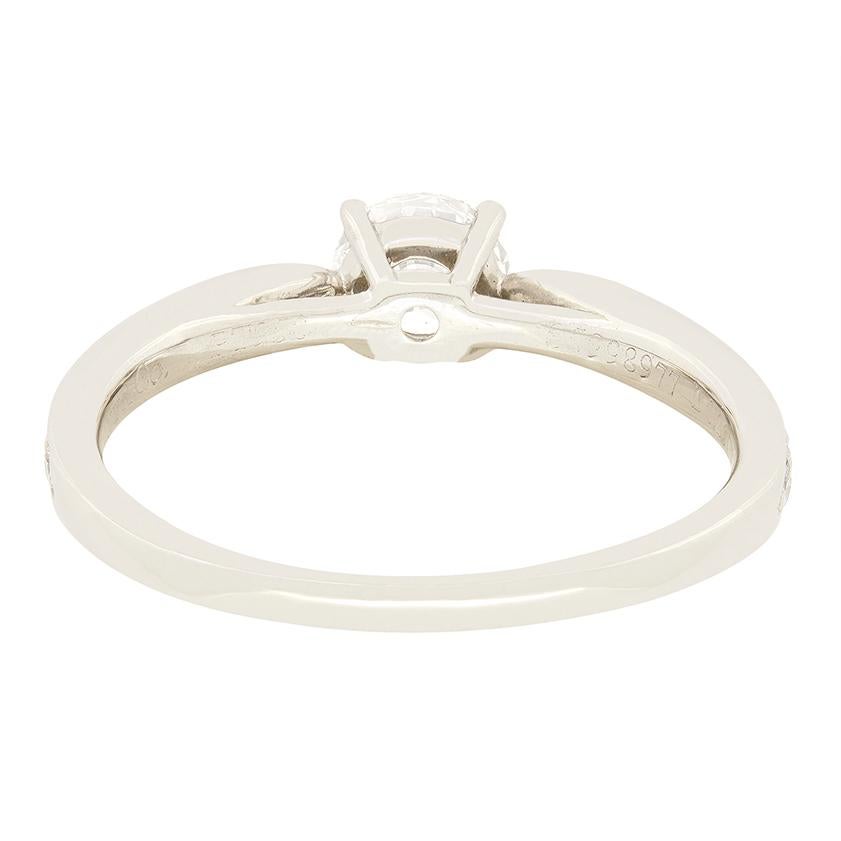 This wonderful solitaire ring comes from Tiffany & Co.’s ‘Harmony’ collection. A single 0.39 carat round brilliant diamond sits central to the piece, claw set into platinum. Graded by Tiffany & Co. themselves the diamond is of immaculate quality