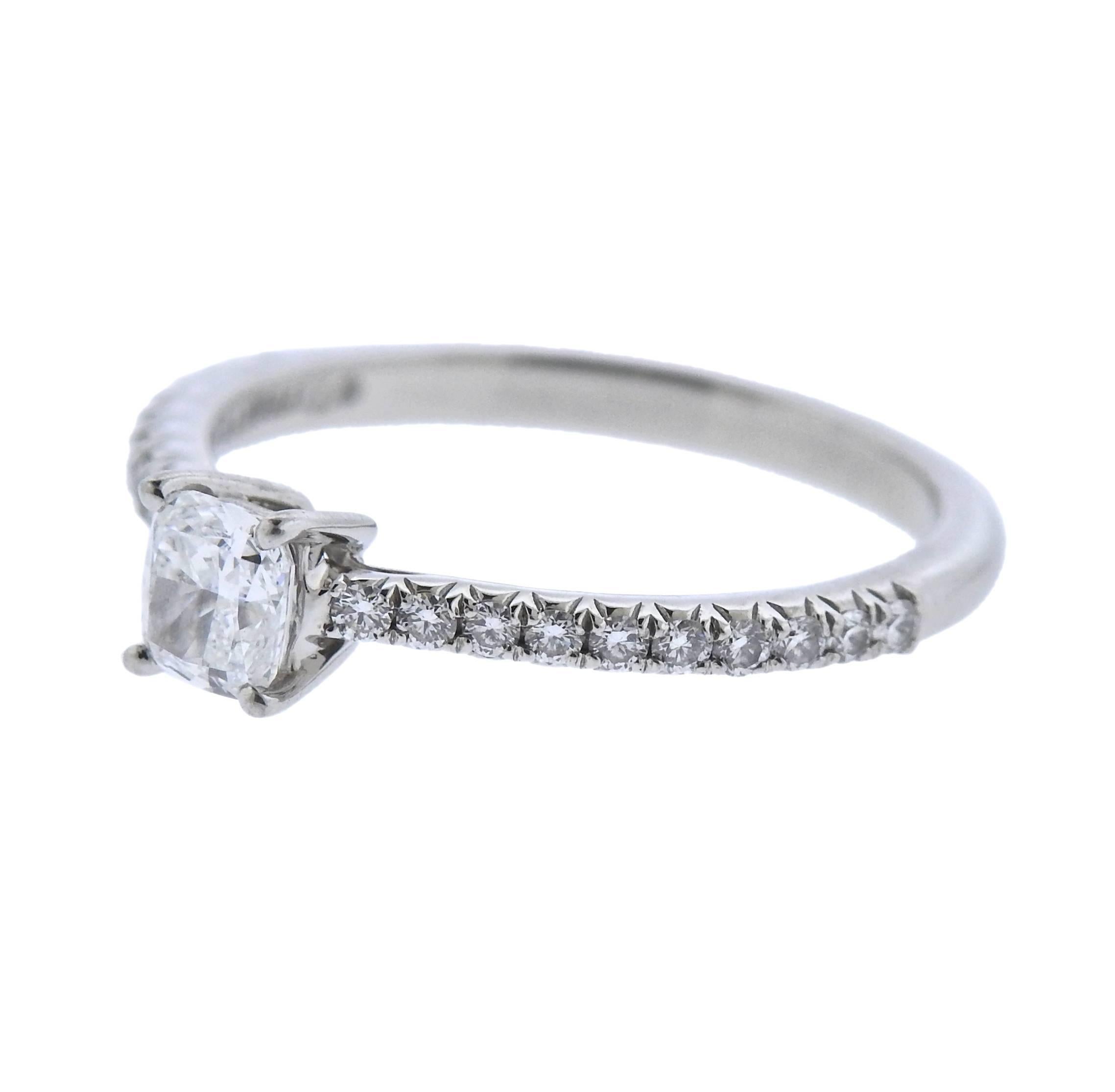  Classic platinum engagement ring, crafted by Tiffany & Co, set with a 0.41ct F/VS1 cushion diamond, surrounded with approx. 0.16ctw in side setting diamonds. Comes with Tiffany & Co Retail Replacement Valuation Paperwork from 2017 of $4960. Ring