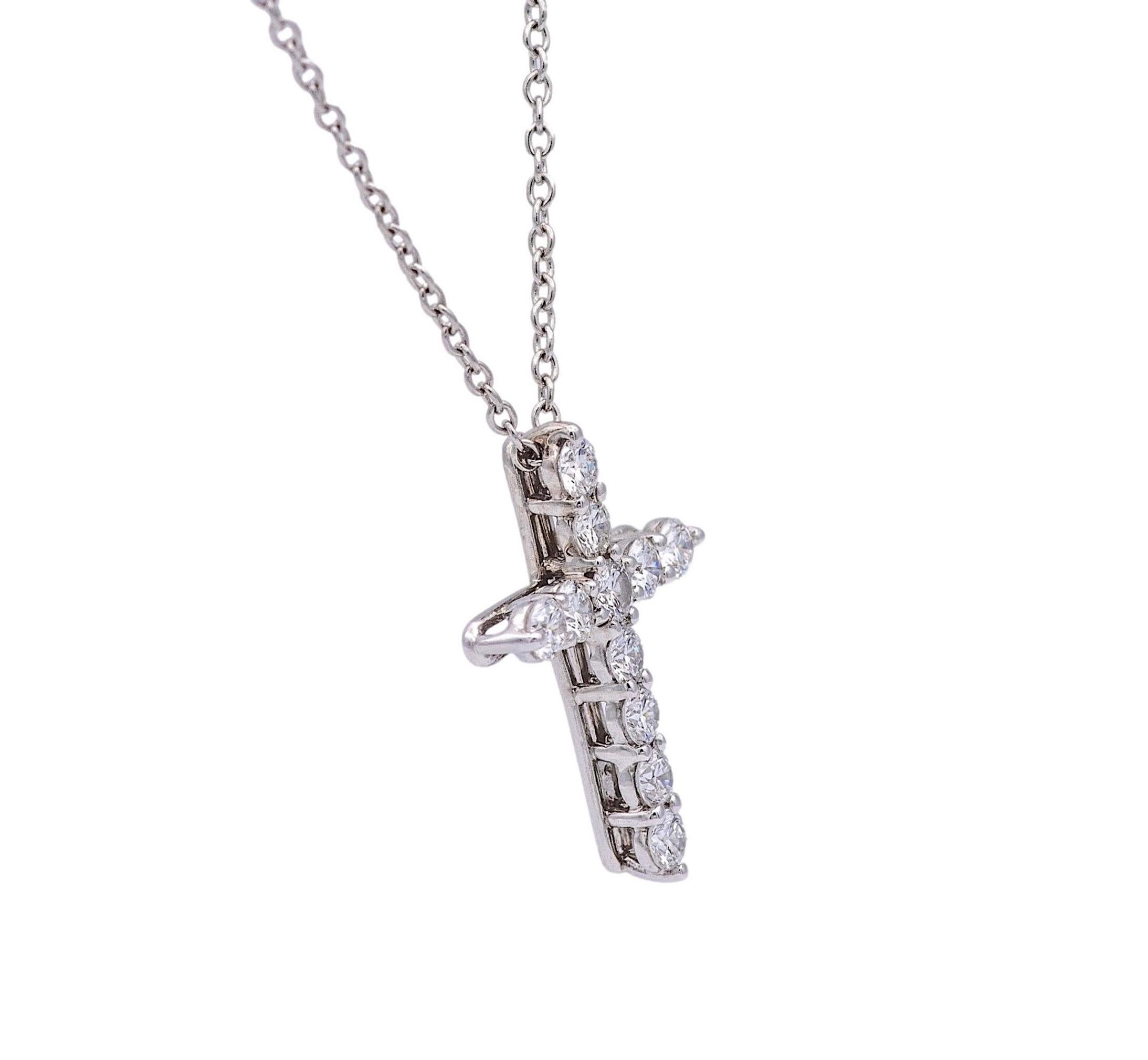 Tiffany & Co. necklace finely crafted in platinum featuring a cross motif slide pendant hanging off a 16