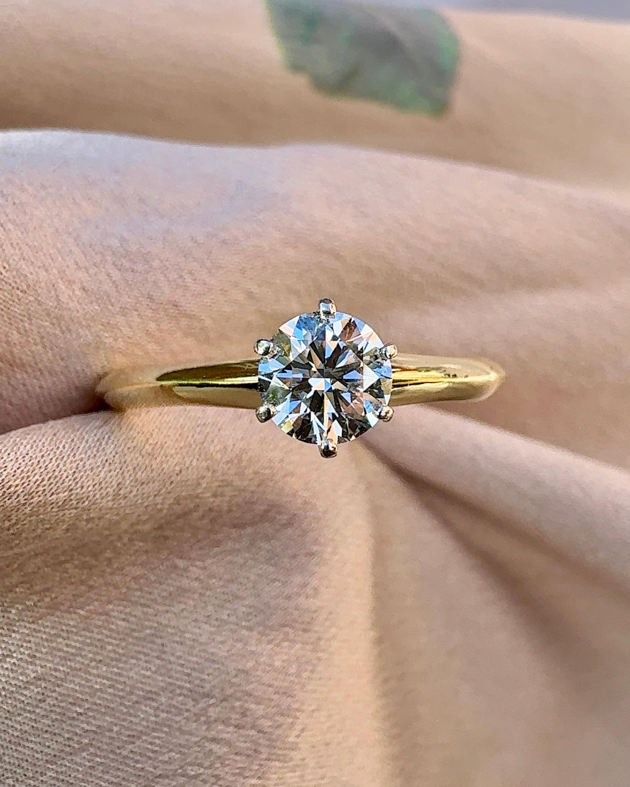 Modern Tiffany & Co. 0.47 carat Diamond Solitaire Ring in 18K Gold For Sale