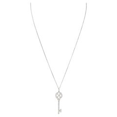 Retro Tiffany & Co. 0.51 Carat Diamond Platinum Quatrefoil Key Pendant Necklace