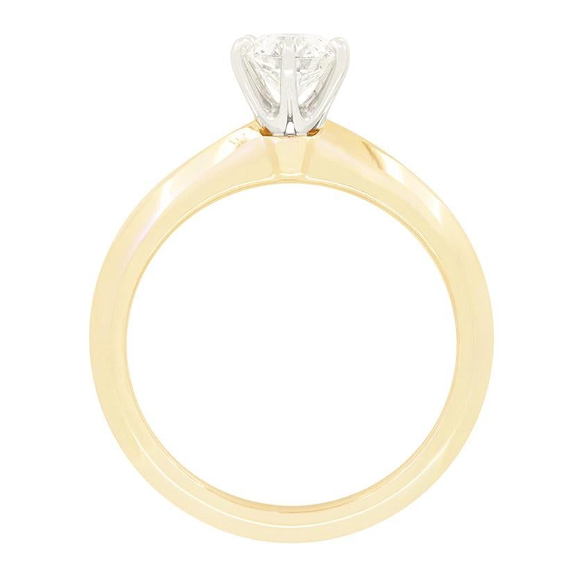 From the designer Tiffany & Co. comes this iconic knife edge solitaire ring featuring a wonderful 0.53 carat, round brilliant diamond at it’s centre. Claw set within their signature six claw collet, the diamond has being graded H in colour and VVS1