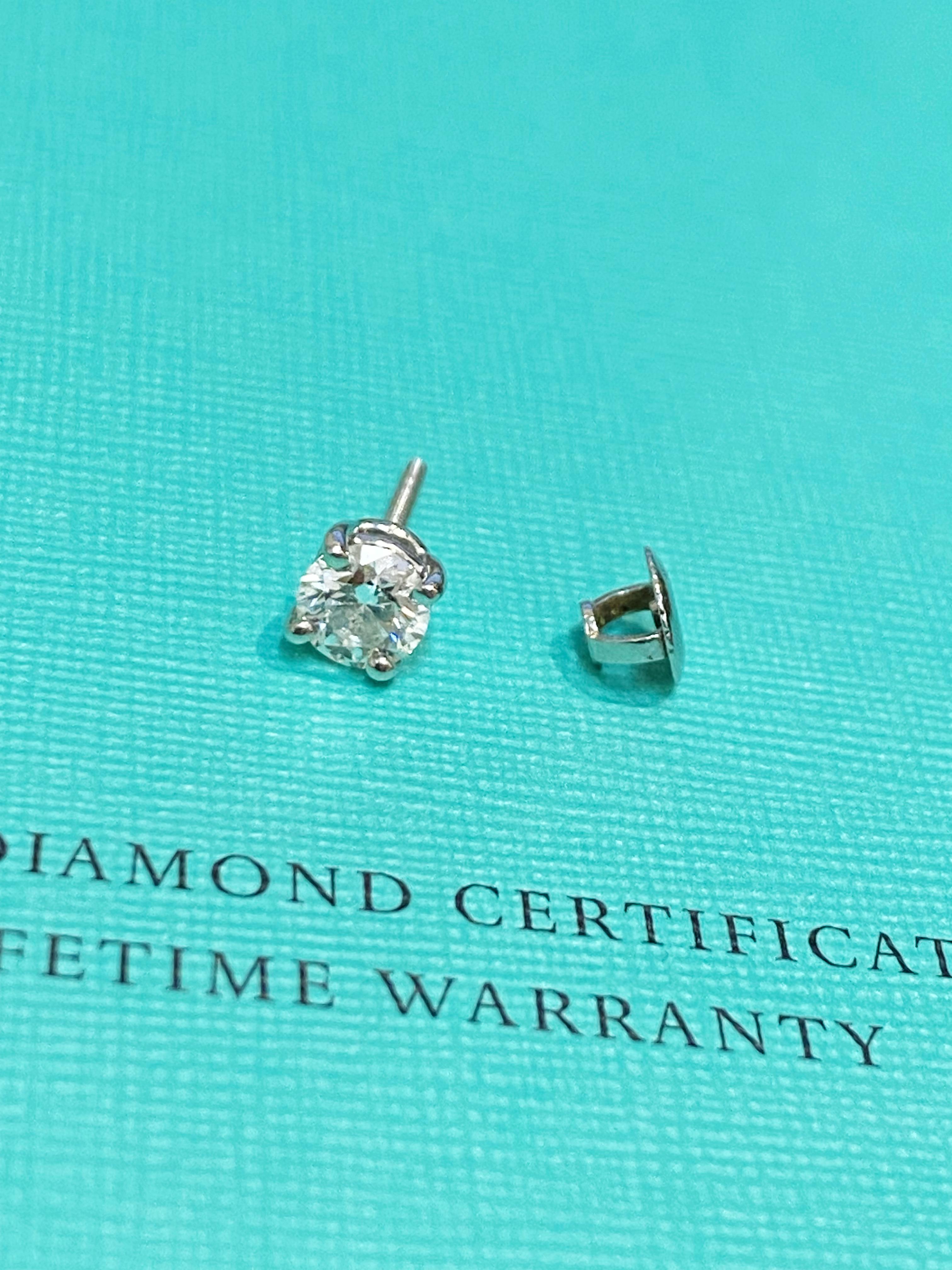 Crafted with refined elegance by Tiffany & Co, 
this dazzling & eye-catching single (1 only) stud earring 
features a Natural Round Brilliant Cut Diamond 
of desirable 0.54ct – known weight 
(5.23 – 5.26 x 3.25mm),
securely 4-claw set in Platinum