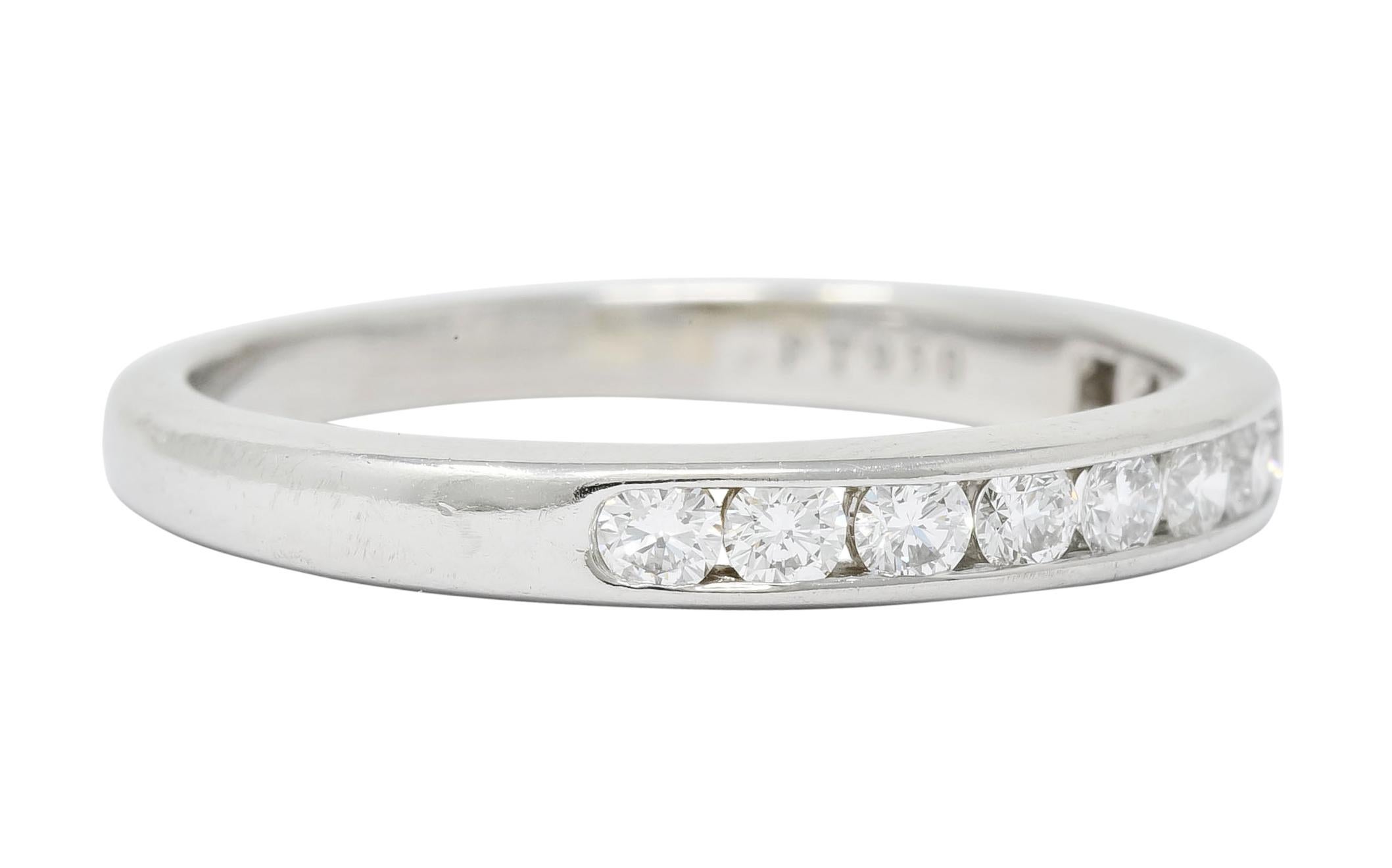 Eternity band style ring centering eleven round brilliant cut diamonds weighing approximately 0.55 carat total, F/G color and VVS clarity

Channel set to front with high polished wall edges

Fully signed Tiffany & Co.

Stamped PT950 for