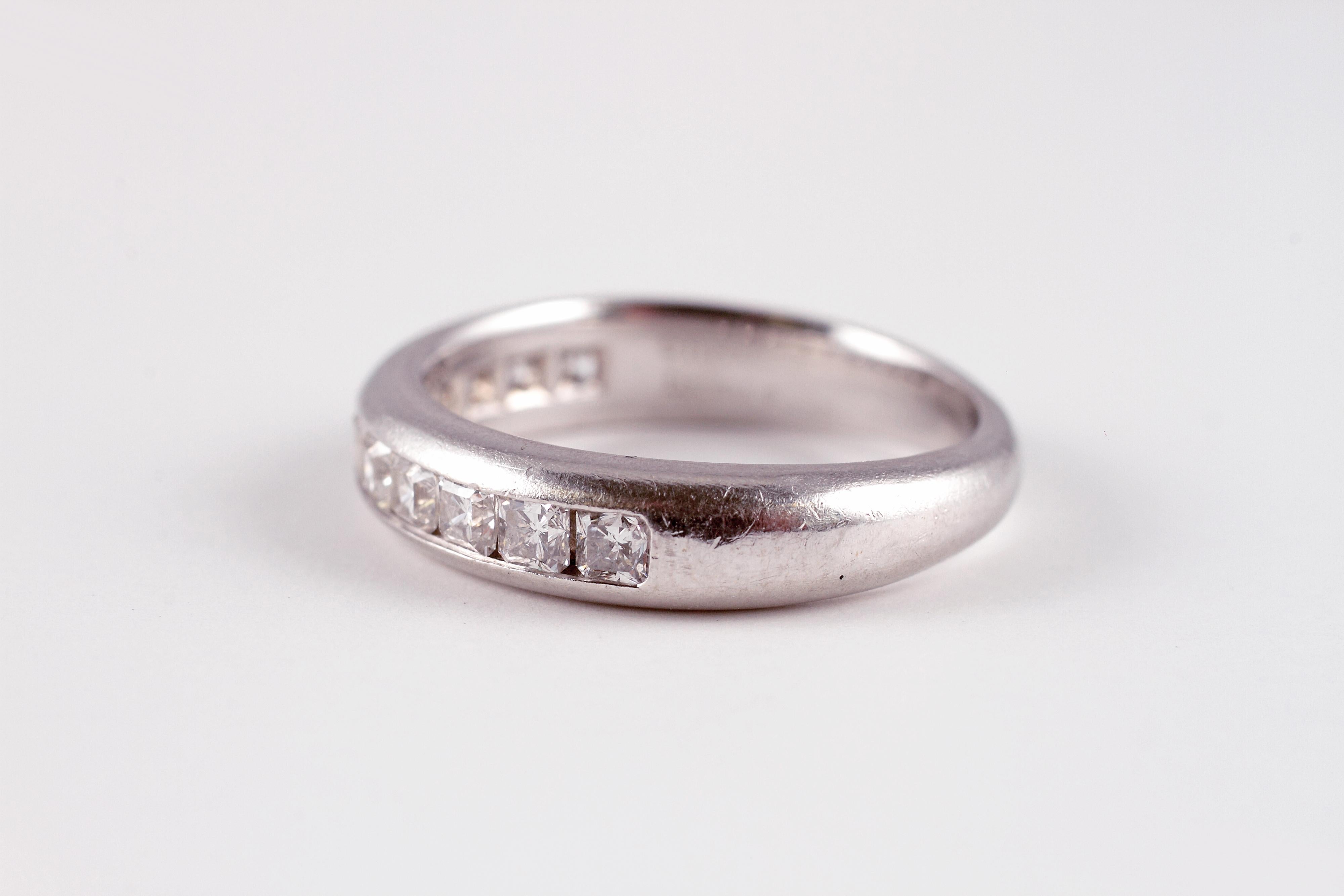 This 4.00 mm, platinum half circle ring supports eleven channel-set, 