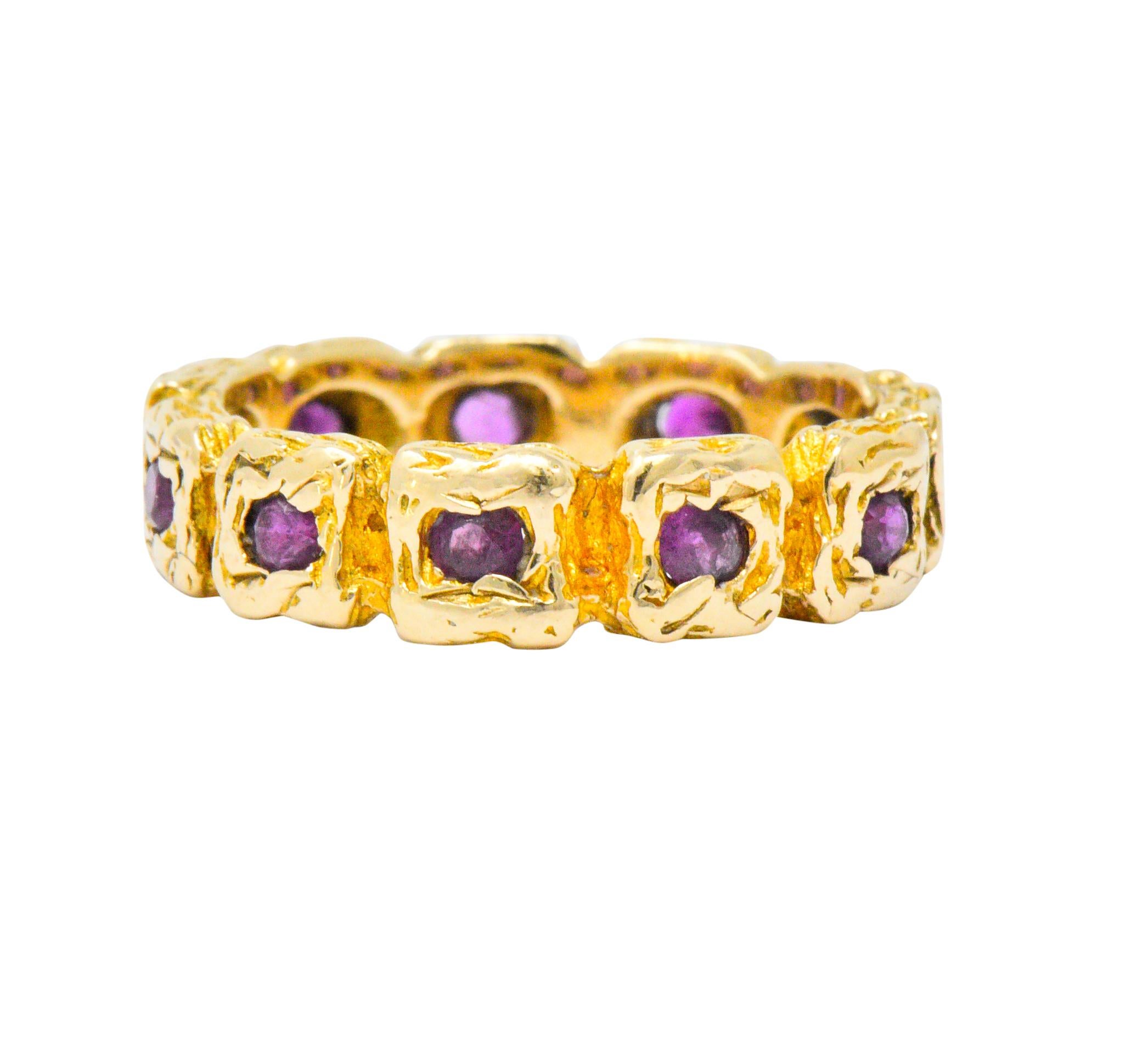 Eternity band ring designed as organically textured squares

Each set with a round cut ruby, weighing in total approximately 0.55 carat

Incredibly well-matched and purplish-red in color

Tested as 14 karat gold

Fully signed Tiffany & Co. 

Circa: