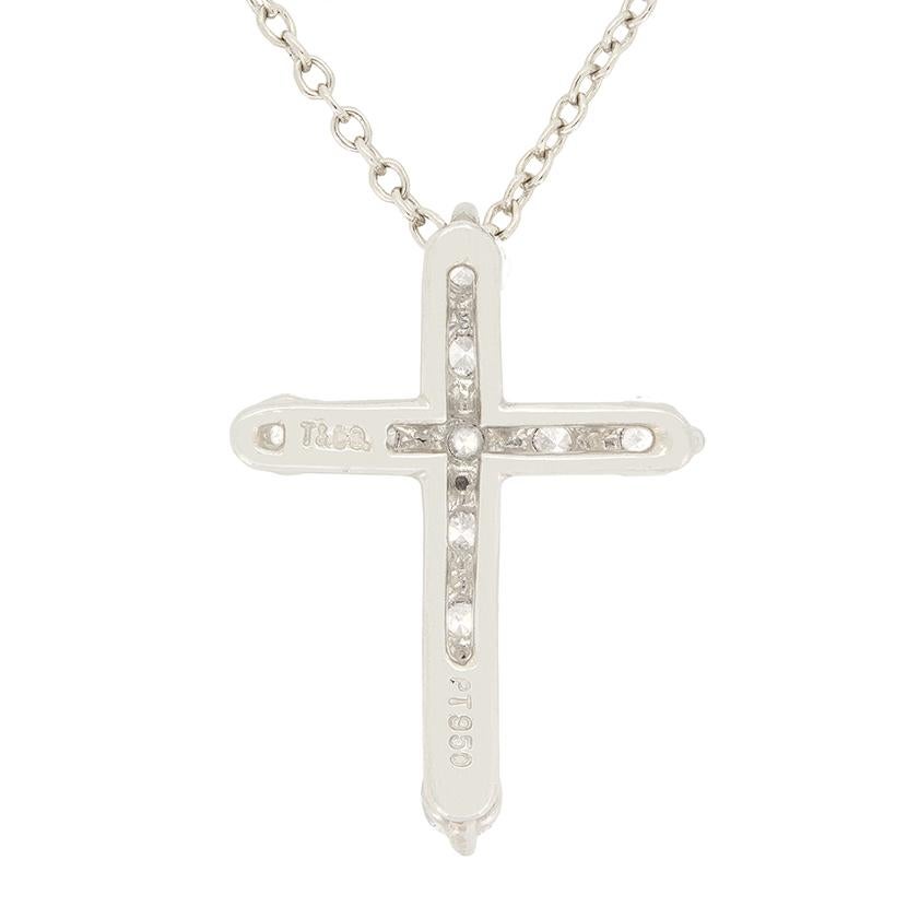 A classic design from Tiffany & Co. this diamond cross necklace was created in the 1990s. A total of 11 0.05 carat round brilliant diamonds are set into the platinum cross shape. Each diamond matches in quality, graded highly at F in colour and VVS