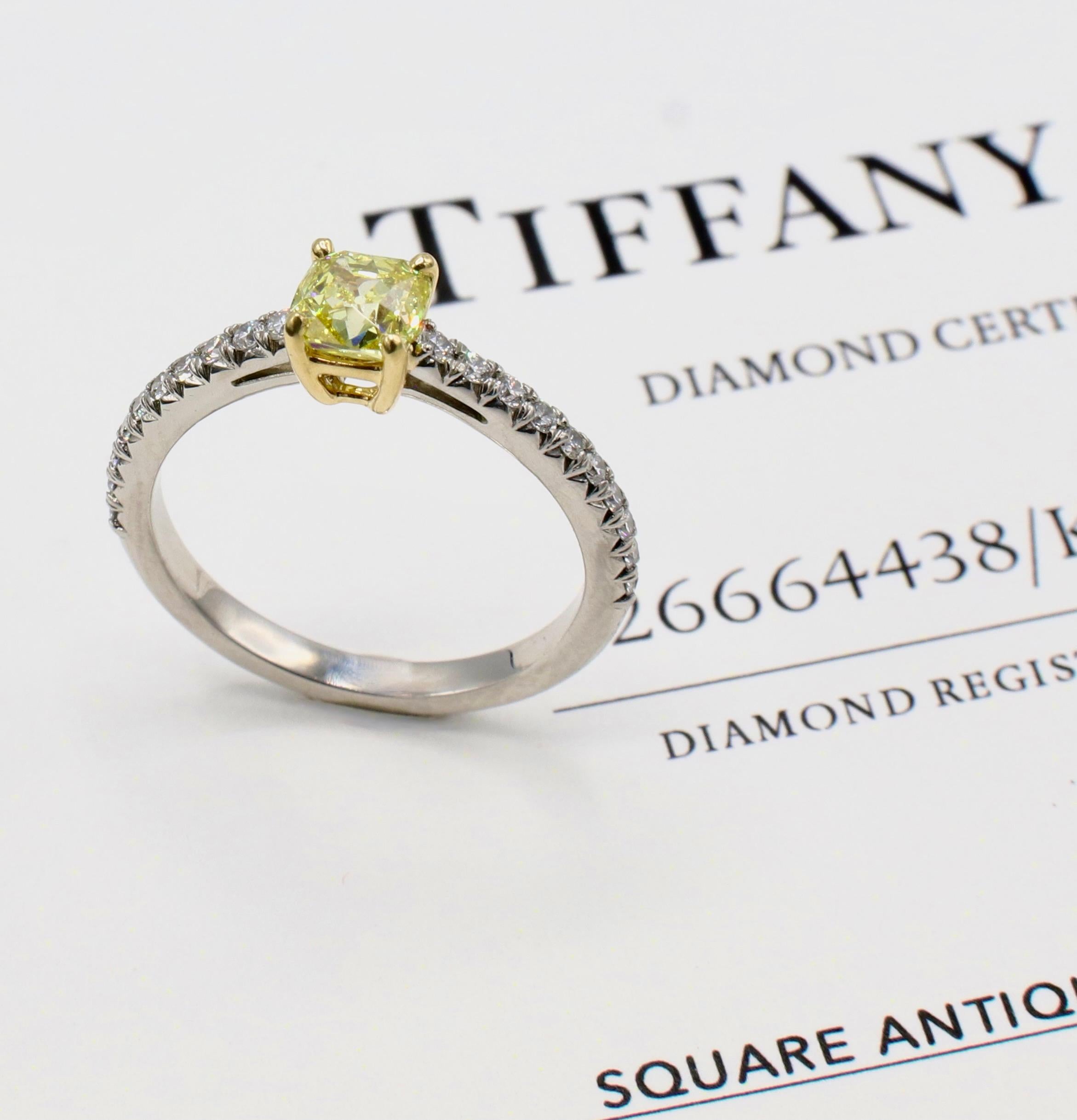 Tiffany & Co. 0.59 Carat Fancy Intense Yellow Square Antique Natural Diamond Engagement Ring
Metal: Platinum & 18K yellow gold
Diamond: 0.59 carat antique cushion fancy intense yellow natural diamond VS1
Accent diamonds: Approx. .20 CTW F-G VS round