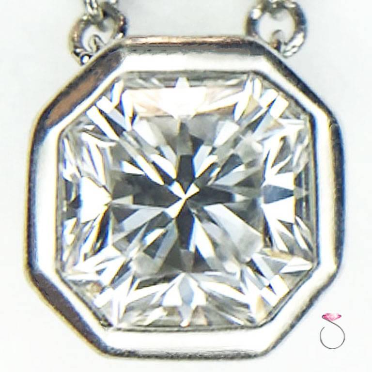 Authentic Tiffany & co. Lucida diamond pendant with Platinum chain. One 0.63 ct. G, VS1 Lucida cut diamond bezel set in platinum and connected to a Tiffany & Co. 16 inch cable link platinum chain with end the piece signed 