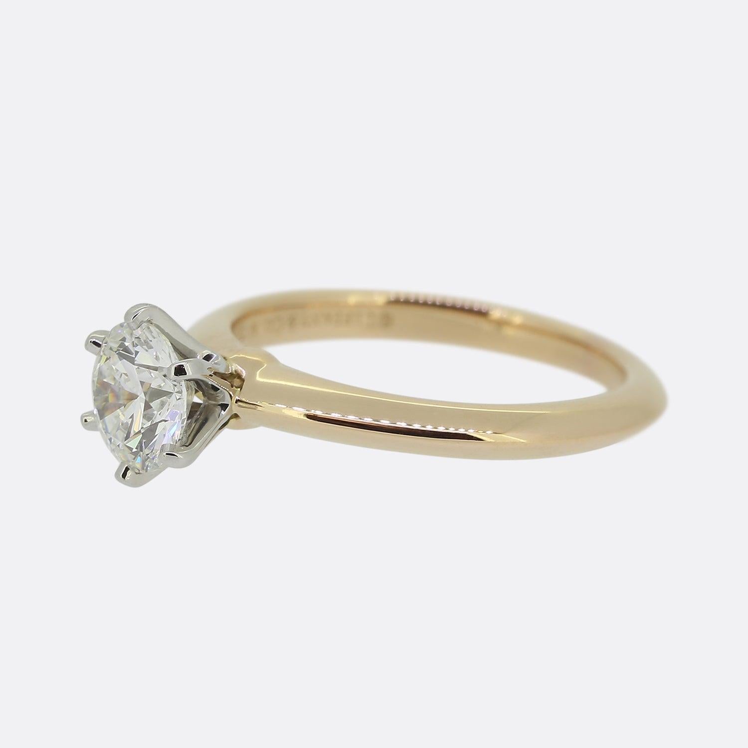 This is an 18ct rose gold Tiffany & Co. diamond solitaire engagement ring. The centre stone is a 0.69 carat round brilliant cut diamond which is set within Tiffanys iconic platinum 6 clawed mount.

Condition: Used (Excellent)
Weight: 3.3 grams
Ring
