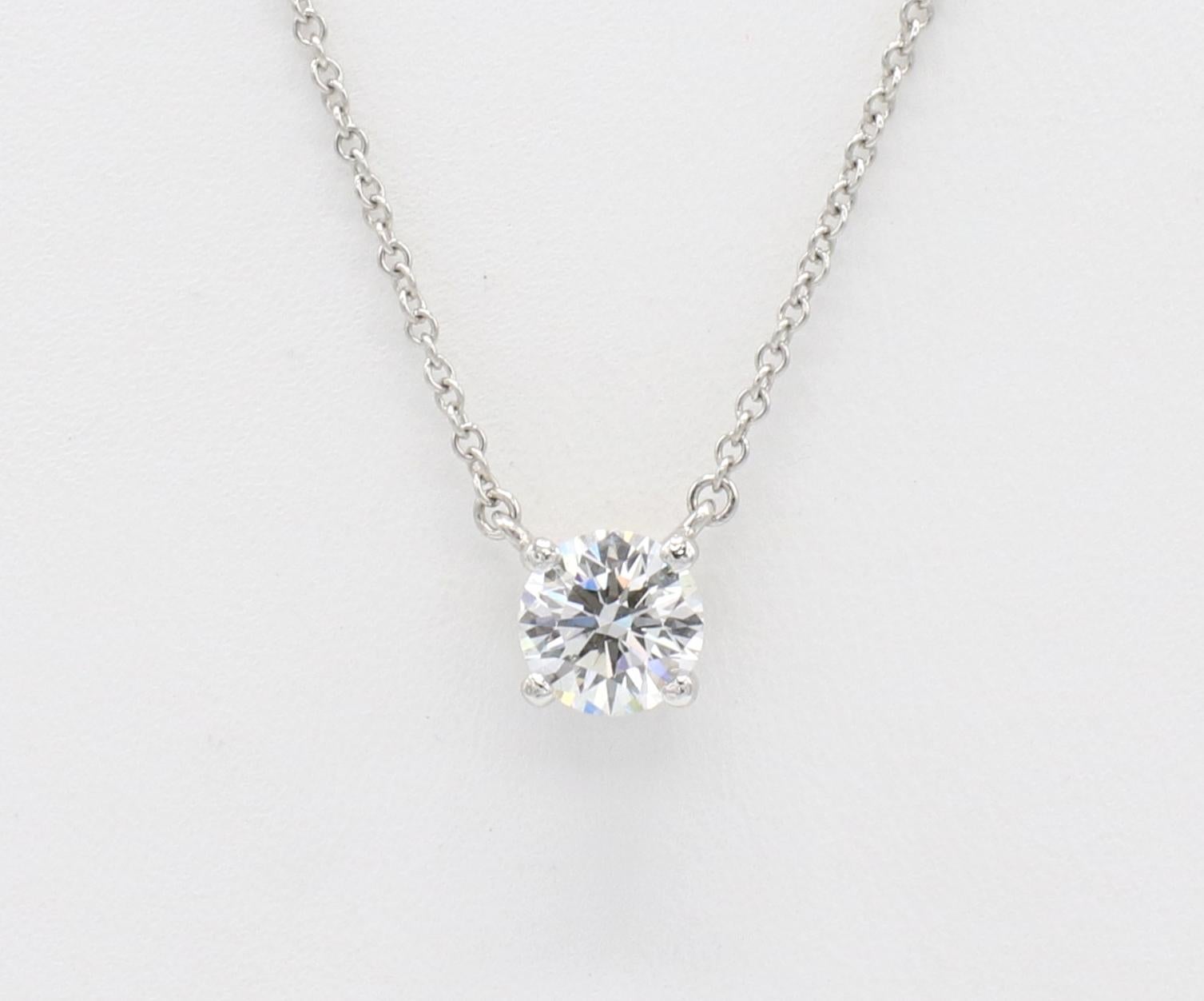 Tiffany & Co. 0.72 Carat F VVS2 Round Natural Diamond Solitaire Platinum Pendant Necklace 

GIA report number: 5221963482
Tiffany & Co. diamond inscription: H07070340
Diamond: 0.72 carat F VVS2 round natural diamond
Metal: Platinum
Weight: 2.7