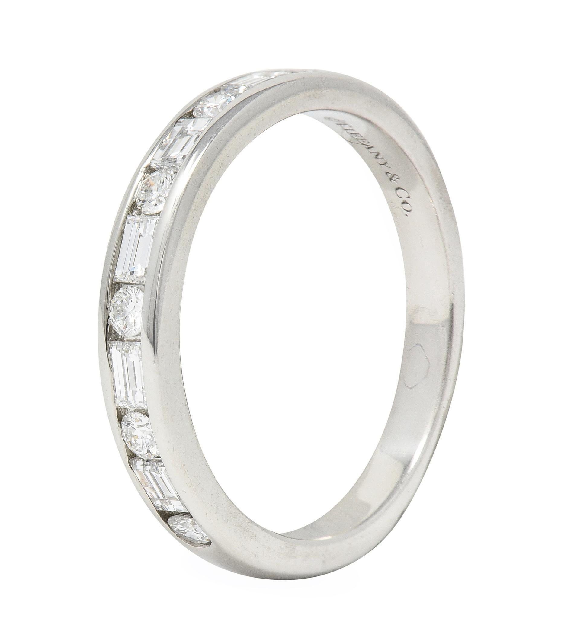 Featuring round brilliant and baguette cut diamonds alternating in pattern
Weighing approximately 0.66 carats total - G color with VS1 clarity
Channel set to front with high polish finish
Stamped for platinum
Fully signed for Tiffany & Co.
Circa: