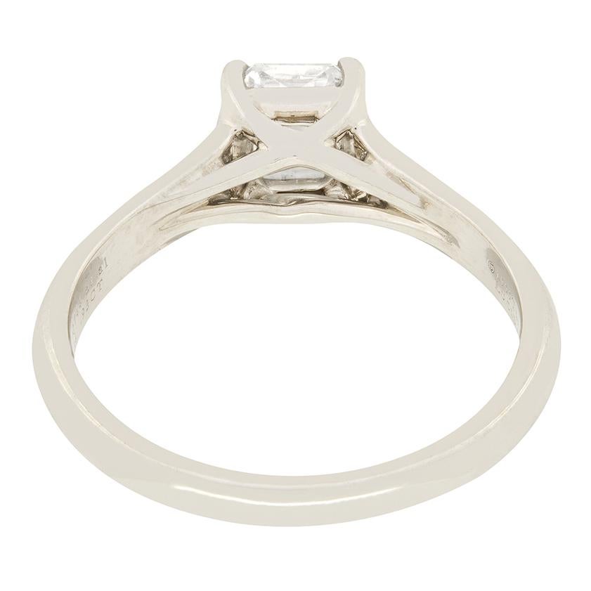 An elegant engagement ring from Tiffany & Co.'s collection set with a gorgeous 0.93 carat Lucida cut diamond in the centre. The diamond has been graded as F in colour and VVS2 in clarity. Set within a plain platinum Lucida band, this diamond will
