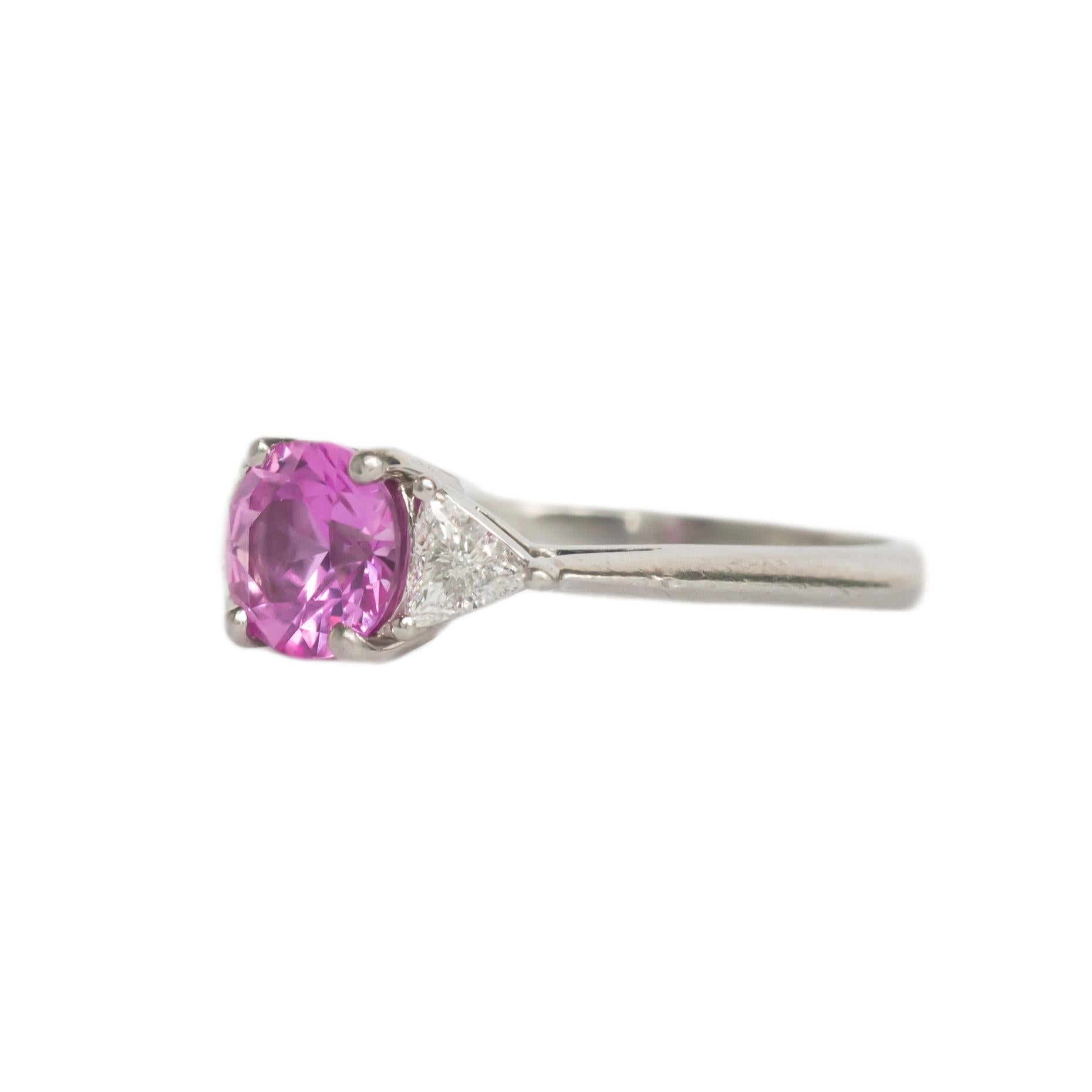 Maker: Tiffany & Co 
Ring Size: 6
Metal Type: Platinum [Hallmarked & Tested]
Weight: 4.9 grams

Center Stone Details:
Type: NATURAL SAPPHIRE
Weight: 1.00 carat
Cut: Round Brilliant
Color: Intense Pink
Clarity: VS

Side Stone Details: 
Weight: .40