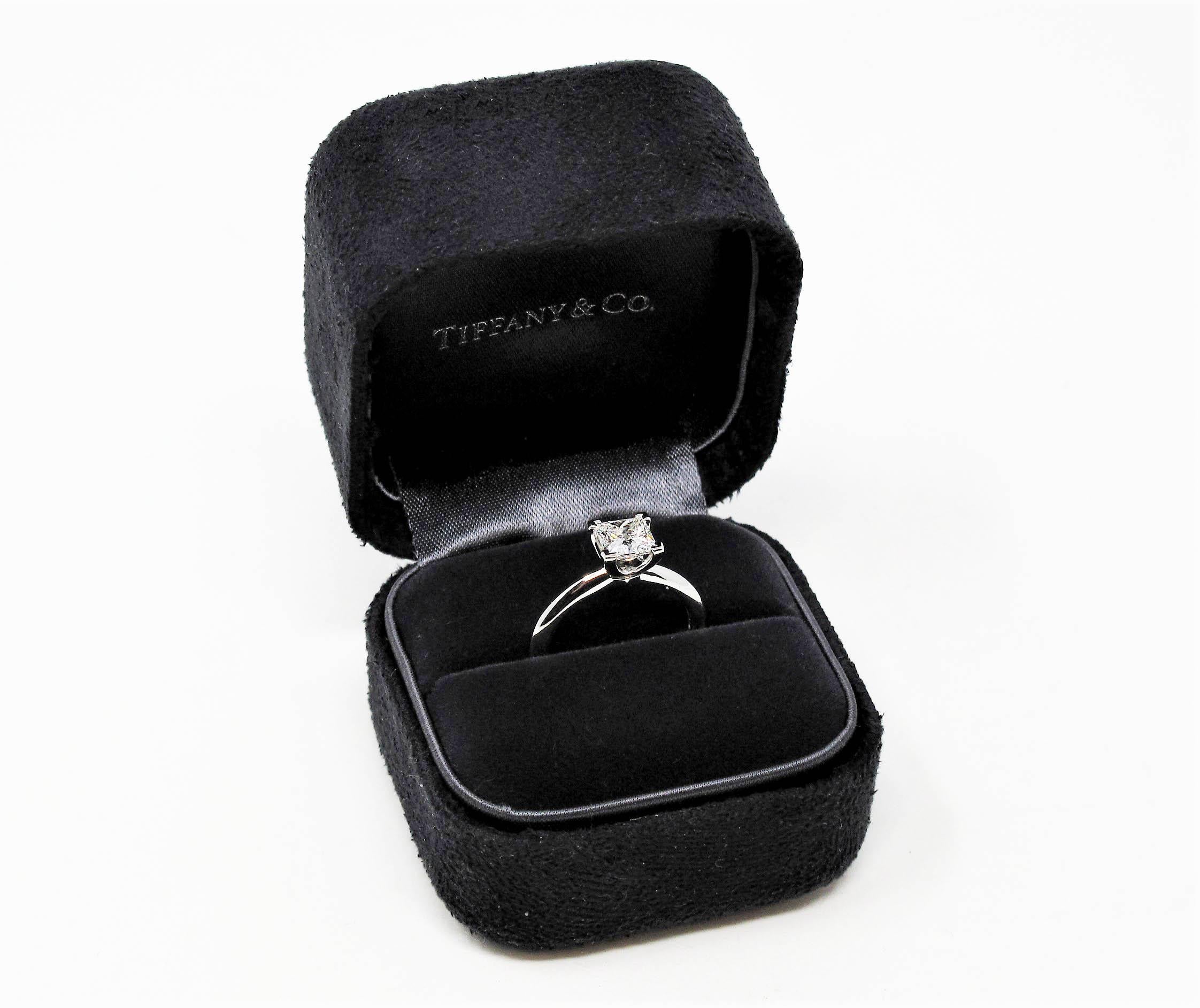 Say yes to this gorgeous diamond solitaire engagement ring from Tiffany & Co.! This classic, Tiffany style diamond solitaire ring is the epitome of timeless elegance. The brilliant square, icy white diamond sparkles radiantly on the finger, while