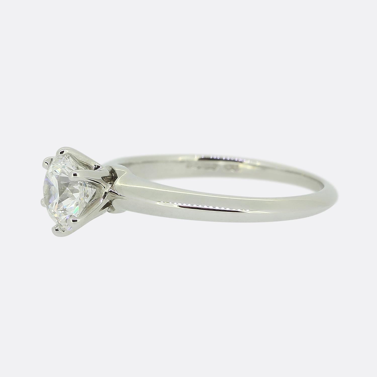 Here we have a wonderful platinum solitaire engagement ring from the world renowned jewellery designer, Tiffany & Co. The centre stone is an impressive 1.01 carat round brilliant cut diamond set Tiffany's iconic 6 clawed mount.

Condition: Used