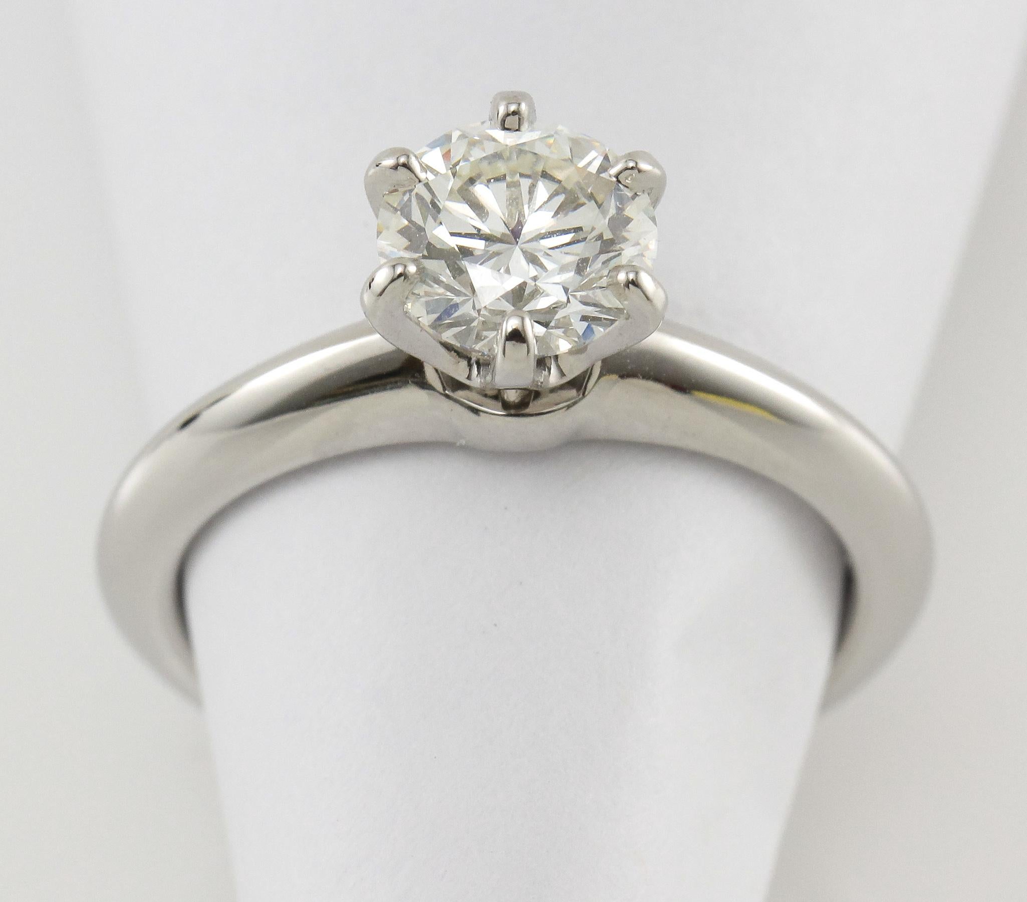 This is the iconic Tiffany & Co. Diamond Solitare Ring with a lustrous 1.02 Carat Round Brilliant Cut Diamond placed in the classic 6-prong Platinum Ring. The lustrous Diamond is I in Color, VS1 in Clarity and includes a GIA Certificate: