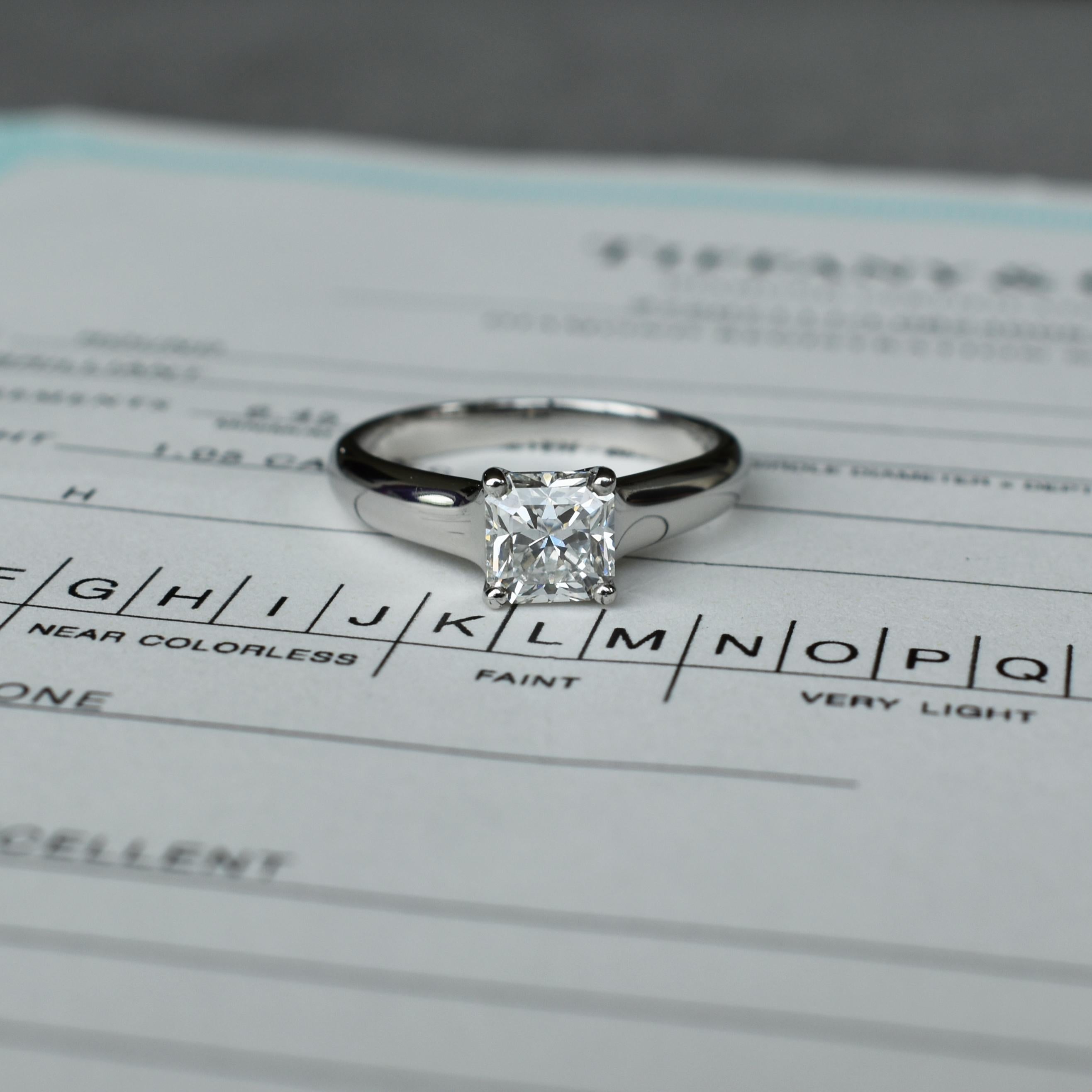 This is an authentic Tiffany & Co. Lucida platinum solitaire engagement ring with a stunning 1.02ct H VS1 Lucida Cut center diamond. This classic style will be cherished for generations and the brilliance and sparkle of this center Diamond is