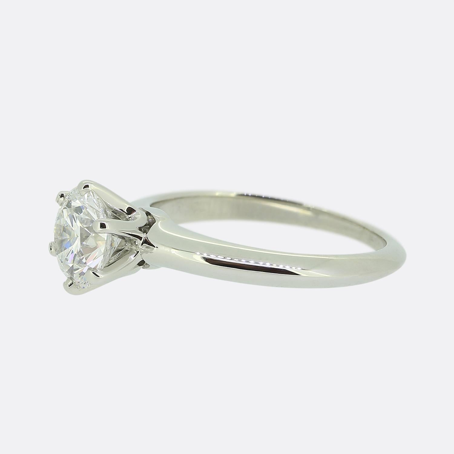 Here we have a platinum solitaire engagement ring from the world renowned jewellery designer Tiffany & Co. This piece offers what is often considered to be the perfect sized diamond for an engagement ring whilst showcasing an astoundingly bright