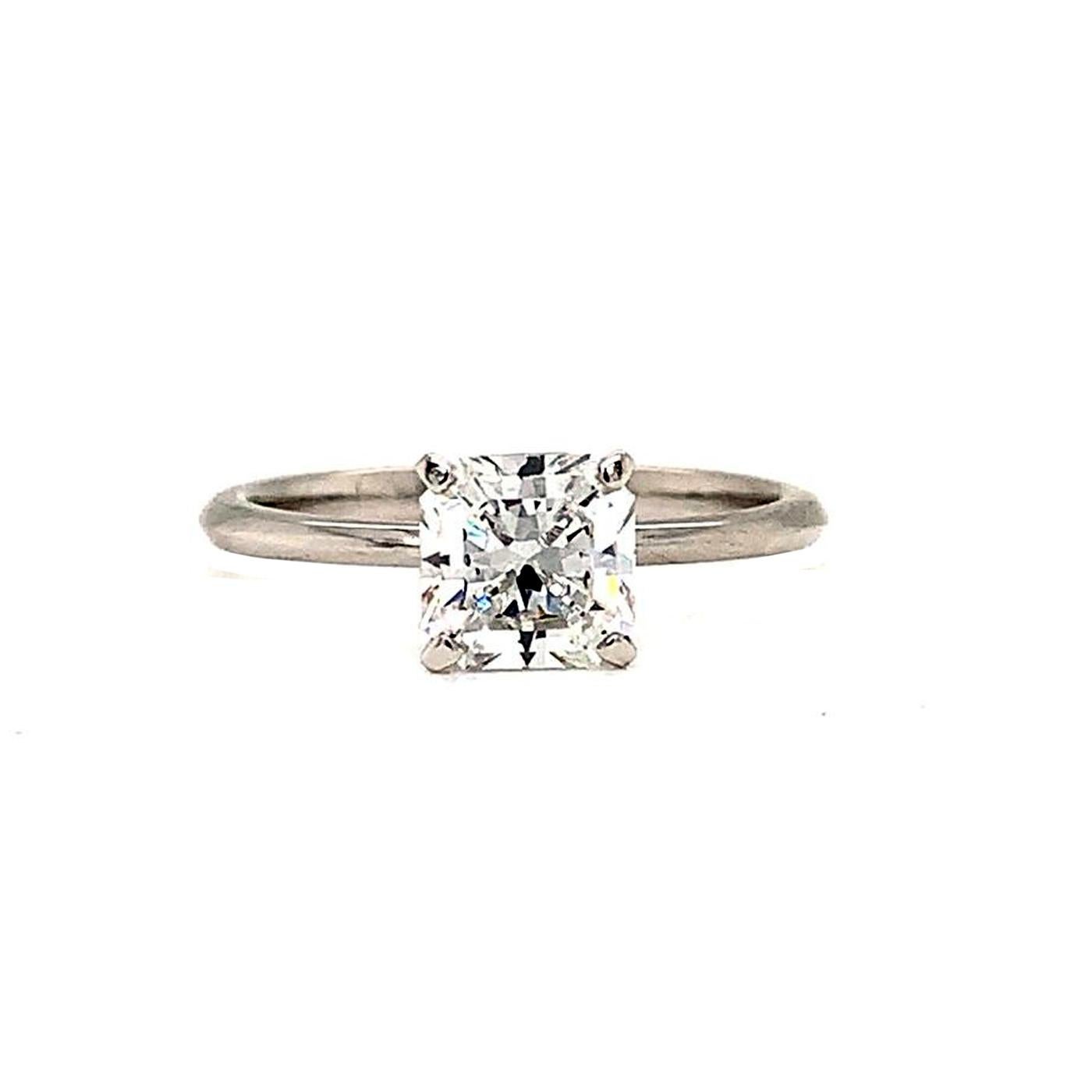 Say yes to this gorgeous diamond solitaire engagement ring from Tiffany & Co.! This classic, Tiffany-style diamond solitaire ring is the epitome of timeless elegance. The brilliant square, the icy white diamond sparkles radiantly on the finger,