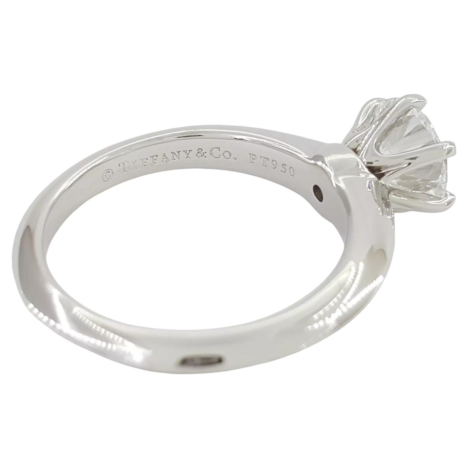 Tiffany & Co. Platinum Round Brilliant Cut Diamond Solitaire Engagement Ring, 1.06 ct Total Weight.

This stunning ring weighs 5.5 grams and is size 4.75 (resizable to any size). The center stone is a 1.06 ct Natural Round Brilliant Cut diamond with