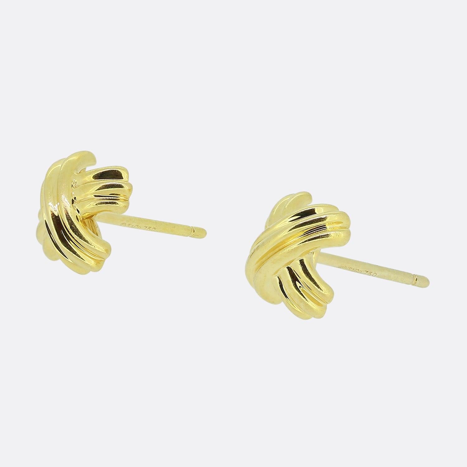 Here we have a classic pair of 18ct yellow gold earrings from the world renowned jewellery designer, Tiffany & Co. These earrings have been crafted into the shape of Tiffany's iconic X design; in this case with a domed 3-D affect and ribbed finish.