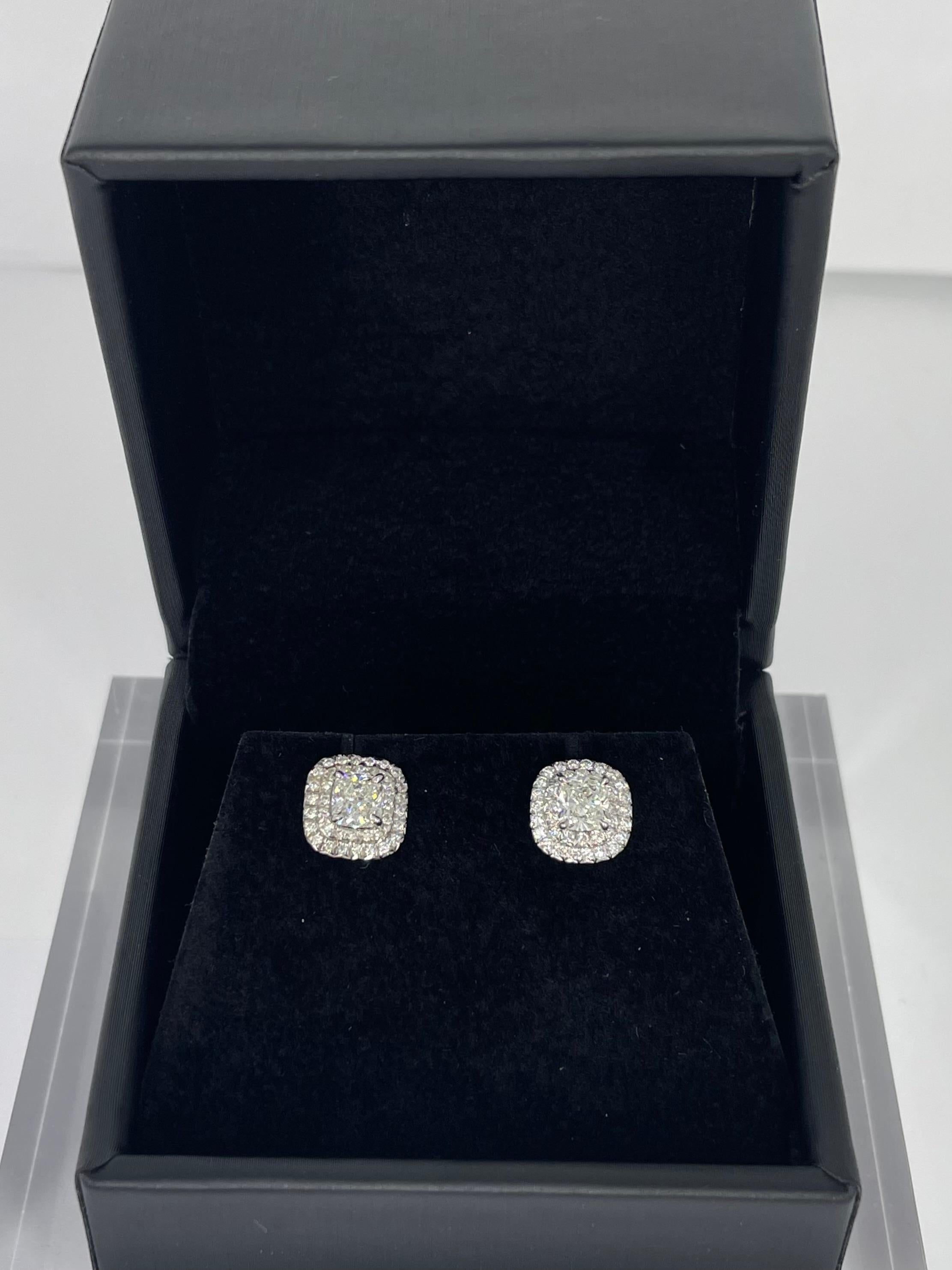 Diamonds by Tiffany & Co will always be a timeless classic. These sparkling diamond studs are from the Soleste collection, and feature 1.10 carat total weight cushion cut diamonds of G/H color. The diamonds are framed by a delicate double row halo