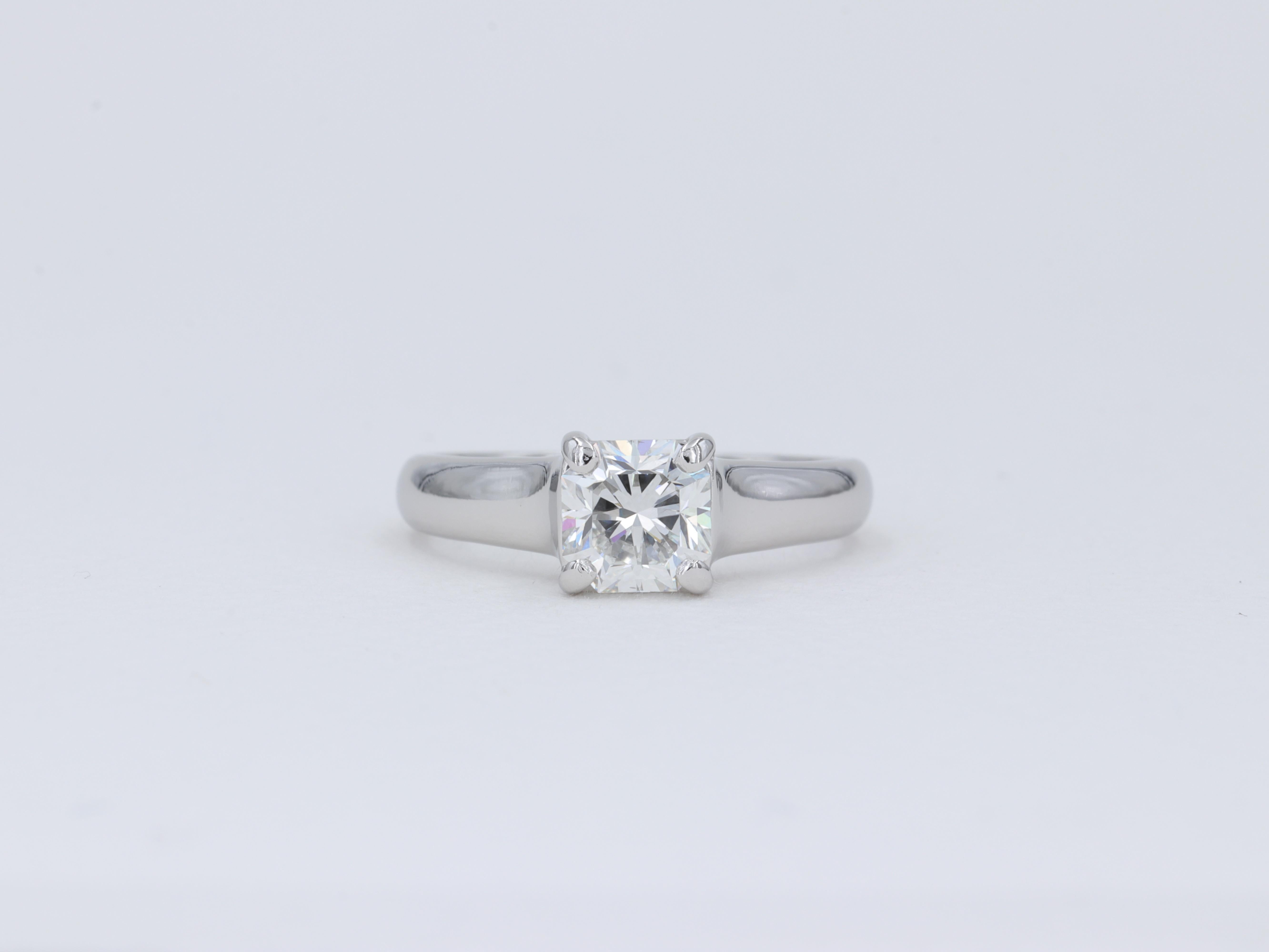 This classic Tiffany & Co. solitaire diamond engagement ring features a 1.13 carat Lucida cut diamond graded G in color and VVS2 clarity by Tiffany & Co. 

The ring is accompanied by the original inside and outside boxes, original diamond