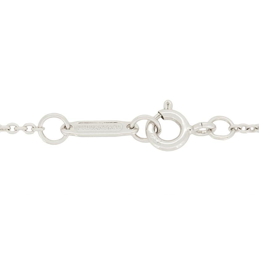 Radiating with sparkle is this diamond pendant from Tiffany’s well known key collection. This particular key design called Victoria, is composed of three different diamond shapes. The mixture of round brilliant, marquise and pear shape diamonds