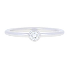 Tiffany & Co. .12 Carat Round Brilliant Diamond Bezet Ring, 18k Gold Solitaire