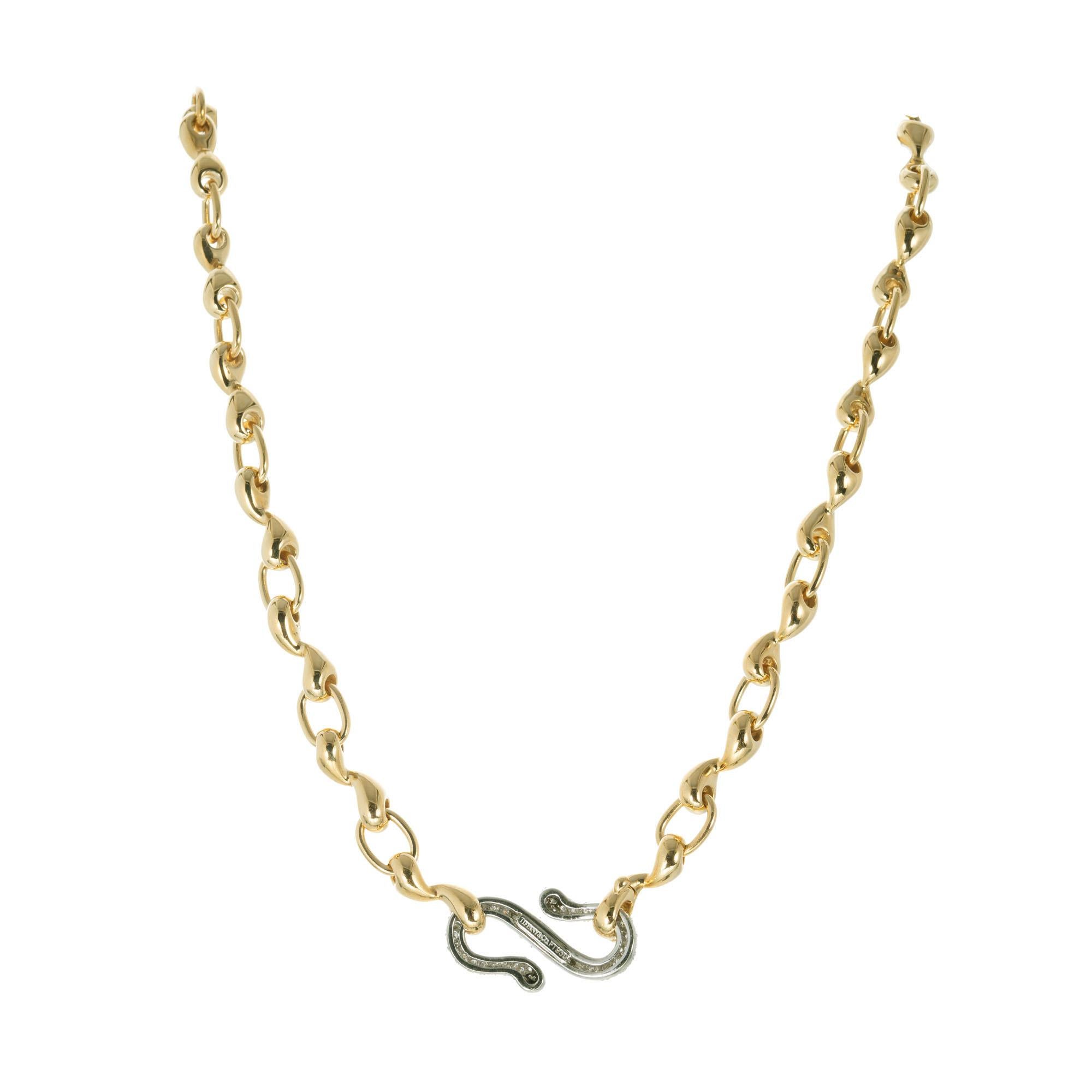 Tiffany & Co swirl link 18k yellow gold necklace with at platinum swirl center section with pave diamonds. 

90 brilliant-cut diamonds F-G, VS, approx. 1.20cts
Length: 17 Inches
18k yellow gold 
Platinum 
Stamped: PT 950 750
Hallmark: Tiffany &