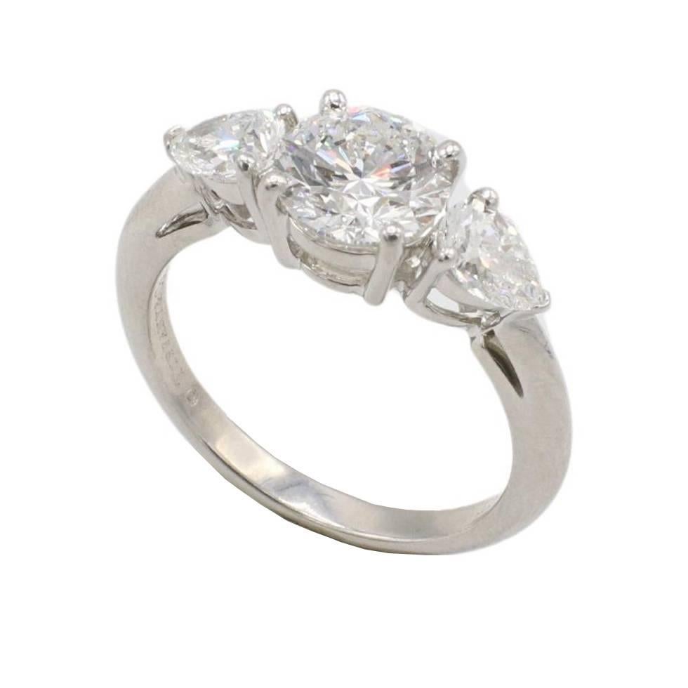 Tiffany & Co. 1.26 Carat Round E VVS2 Natural Diamond Three-Stone Pear Shape Platinum Engagement Ring
Metal: Platinum
Weight: 4.80 grams
Center diamond: 1.26 carat E VVS2 round natural diamond
Accent diamonds: 0.33 carat E VVS1 & 0.32 E VVS1 natural
