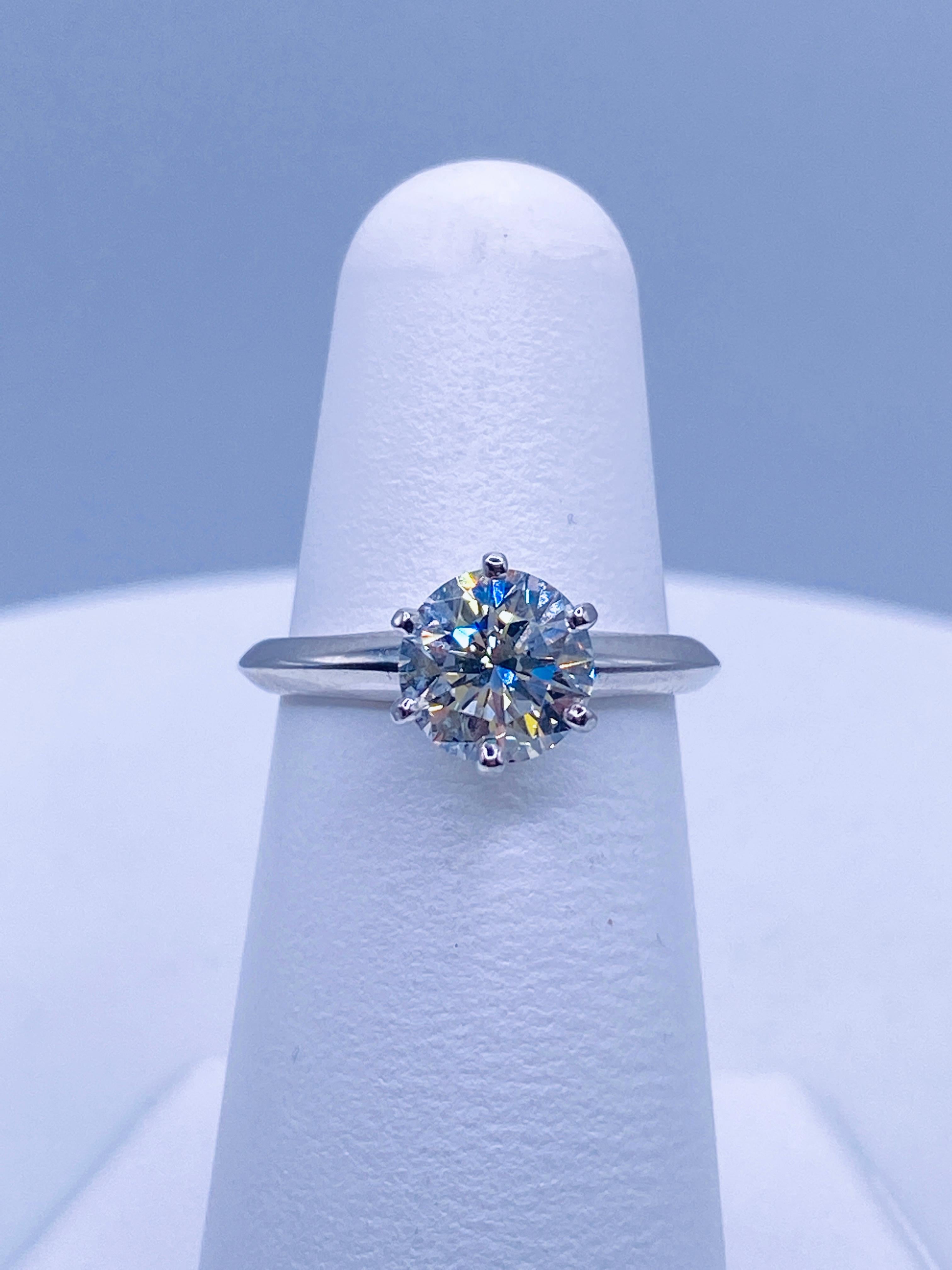 Tiffany & Co 1.27 carat I/VS2 round brilliant cut diamond solitaire engagement ring in platinum. Size 5.25