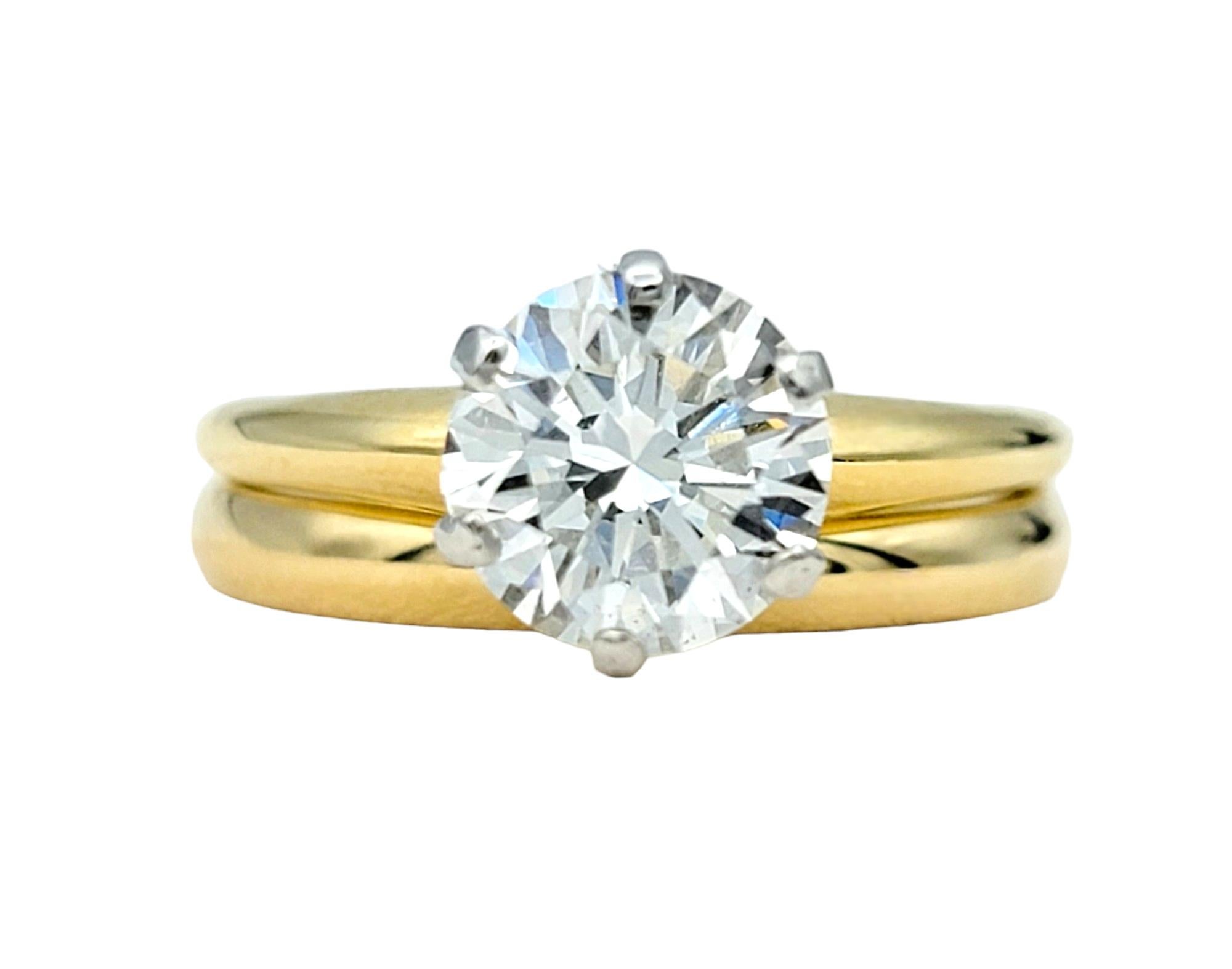 Solitaire Ring Size: 5.25
Band Ring Size: 5

This exquisite Tiffany & Co. solitaire diamond engagement ring and wedding band set, crafted in radiant 18 karat yellow gold, epitomize timeless elegance and sophistication. The classic solitaire diamond