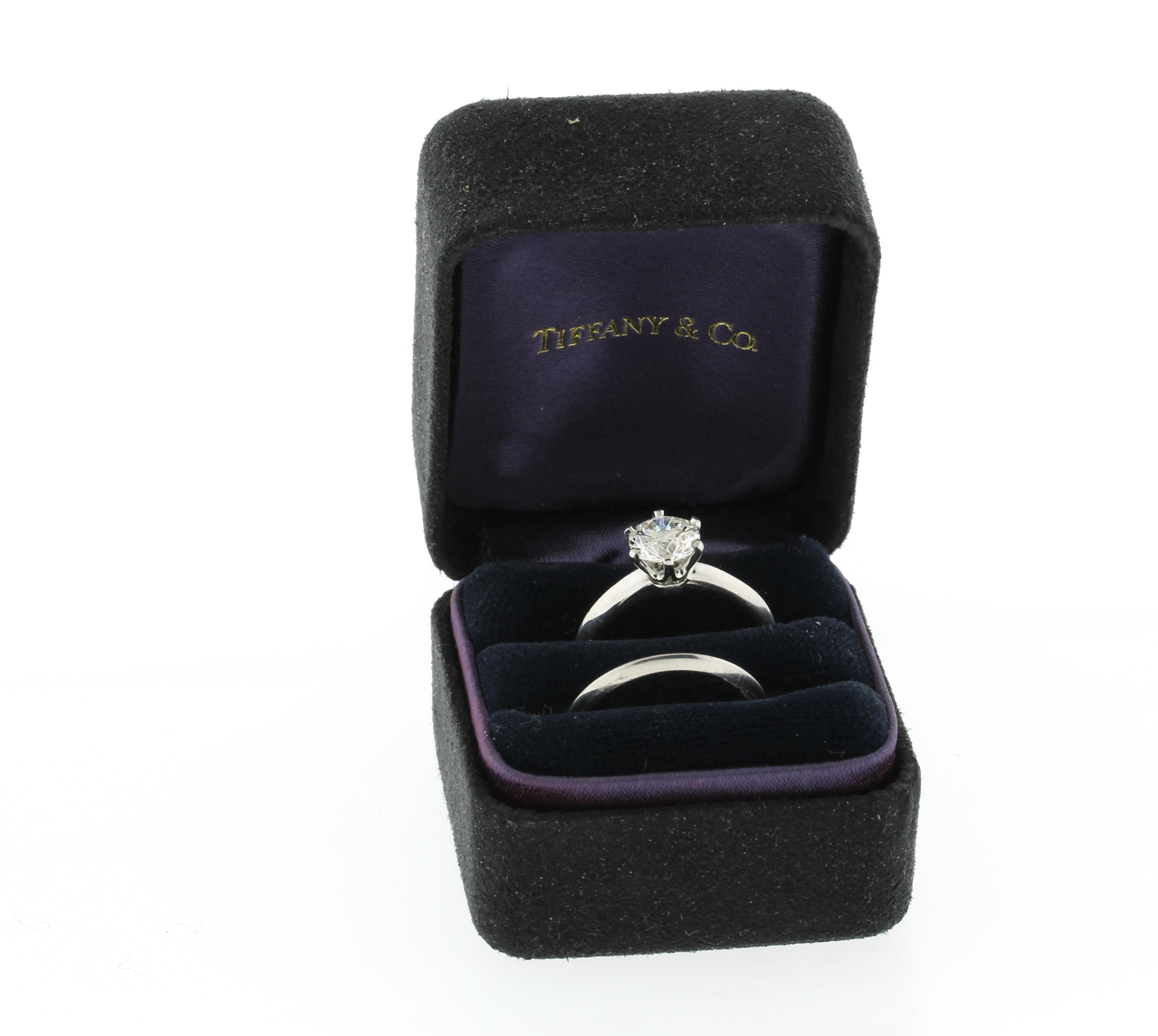 The ring features a center brilliant cut diamond weighing 1.34 carats. The diamond is I color and VS1 clarity.  All Tiffany & Co rings are pre-owned and sold with authentic Tiffany & Co  boxes.  Pampillonia is not affiliated with Tiffany & Co.  All